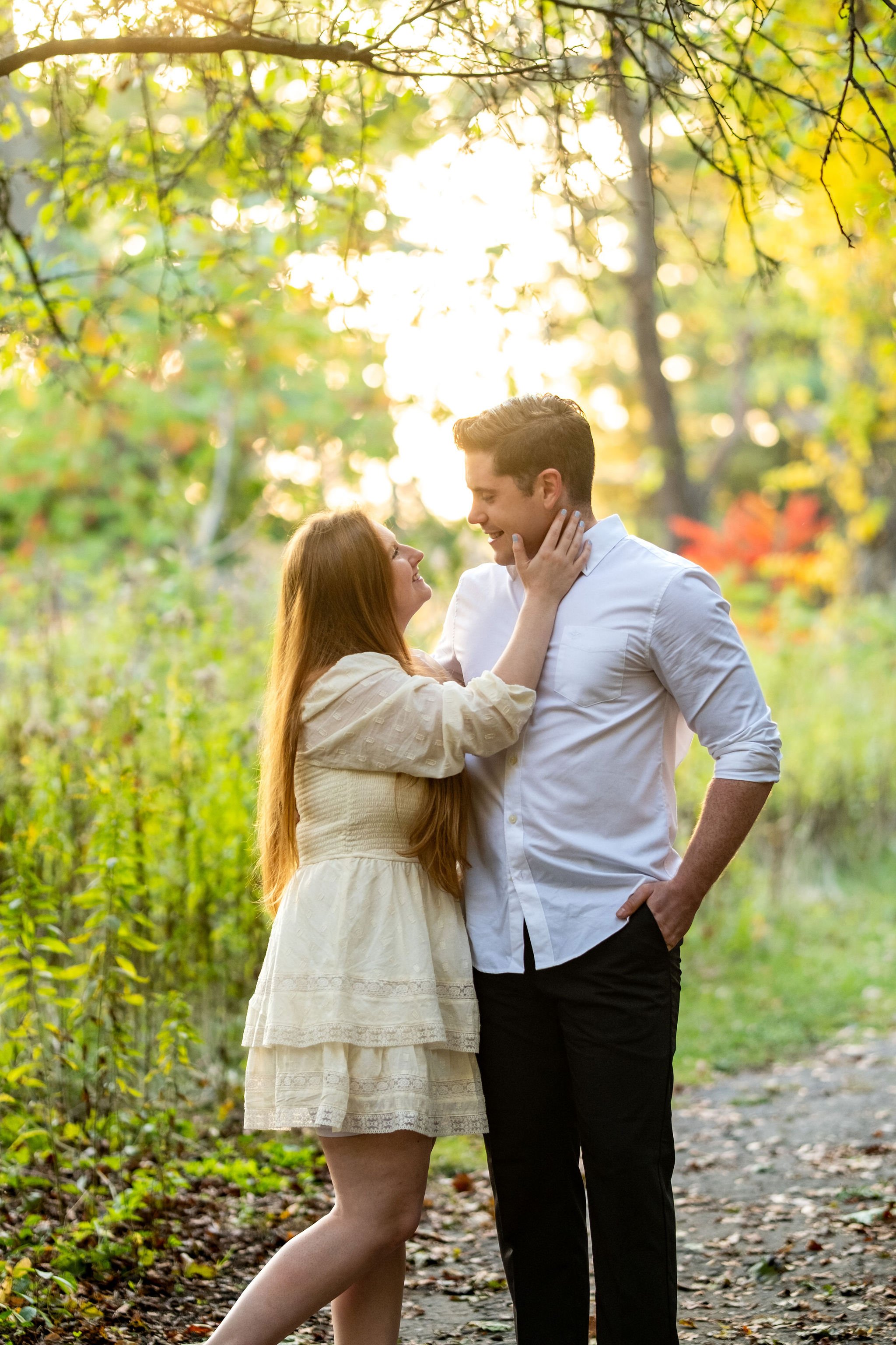 Kayla and Ethan engaged couple intimate forest path portrait golden hour Odiorne Point State Park Rye New Hampshire engagement photography VMG Productions