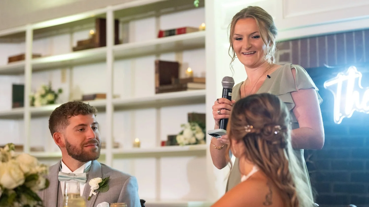 Bridesmaid giving a toast during reception speeches, Godfrey wedding, Maine