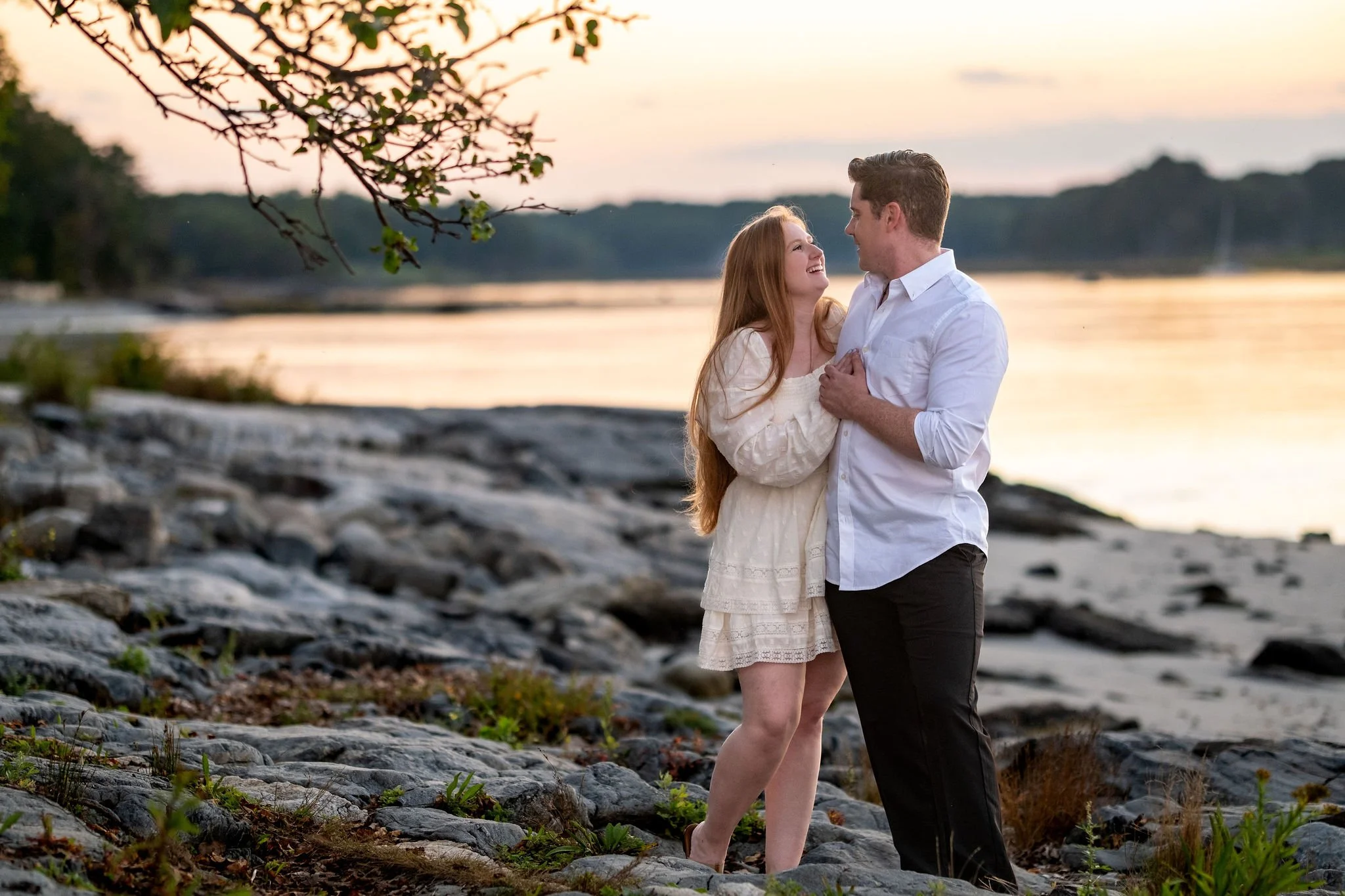 Kayla and Ethan engaged couple walking rocky coast at sunset Odiorne Point State Park Rye New Hampshire engagement photography VMG Productions