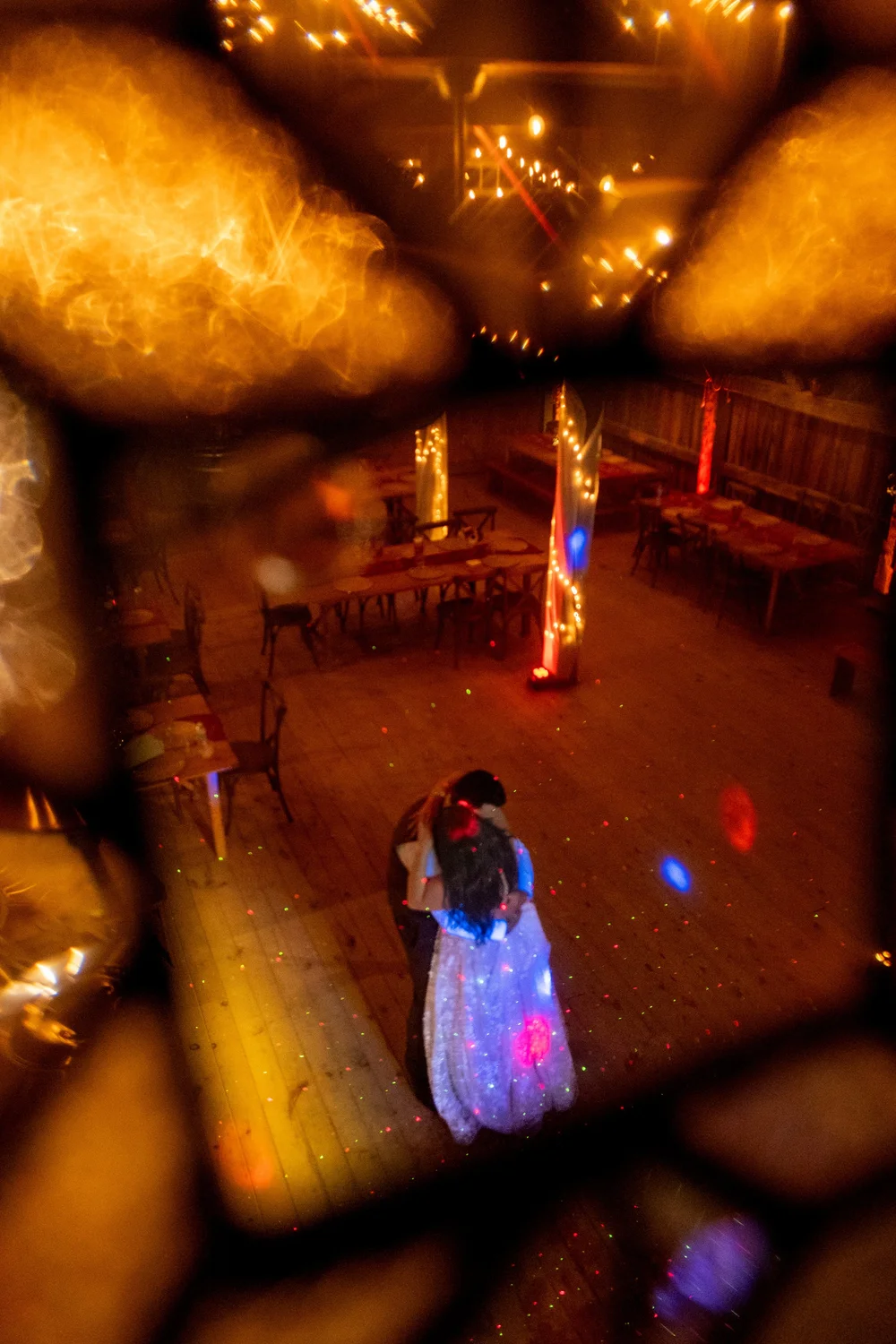 Meagan and Joshua dancing from balcony view in barn reception at The Watson Homestead Hiram Maine fall wedding photography VMG Productions