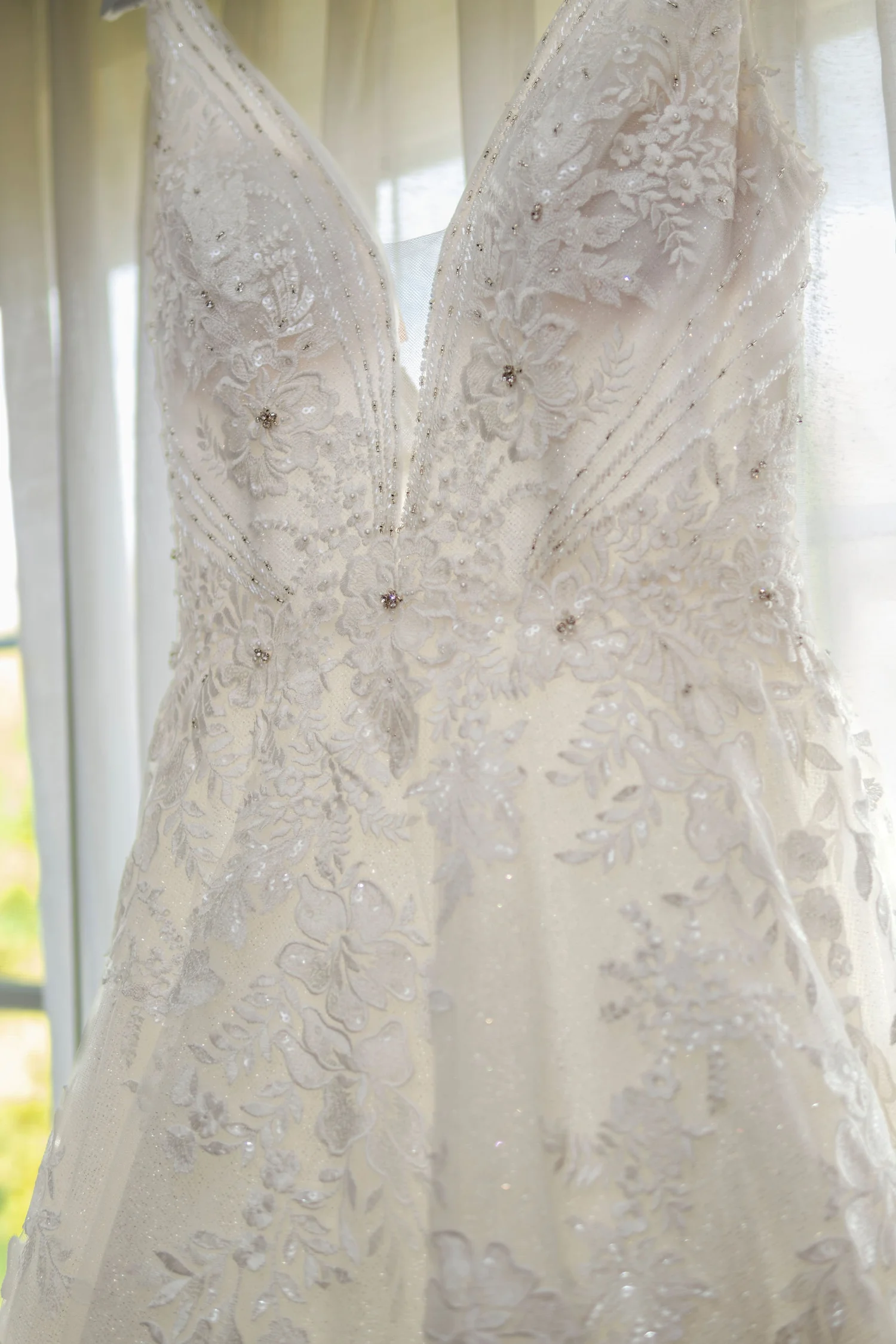 Bride getting ready before a fall farm wedding in Winthrop Maine