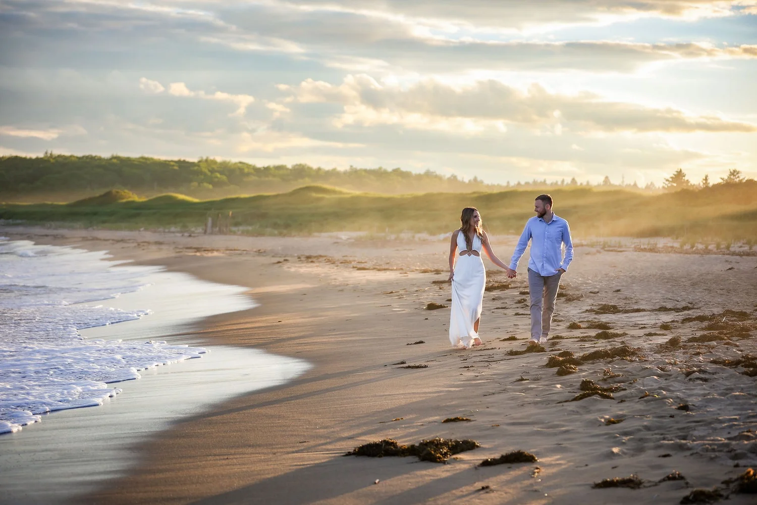 Couple walking the beach at Reid State Park, Georgetown, Maine, engagement session by VMG Productions