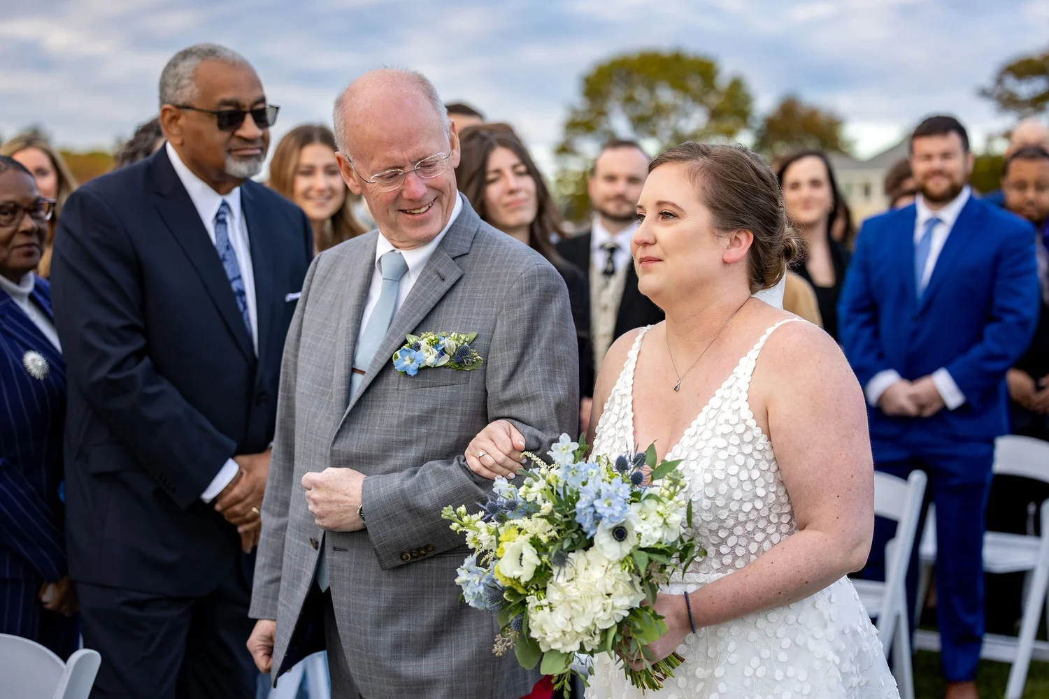 Kaitlyn and father sharing a smile during ceremony aisle walk Nonantum Resort Kennebunkport Maine fall wedding VMG Productions