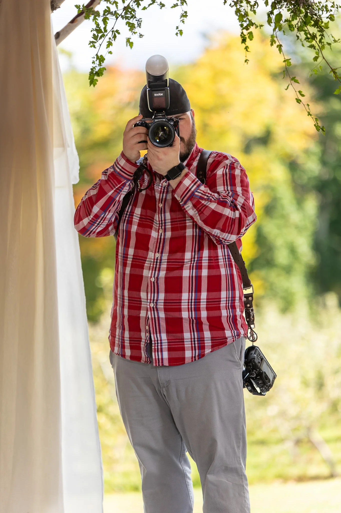Matt, founder of VMG Productions, photographing outdoors in the fall
