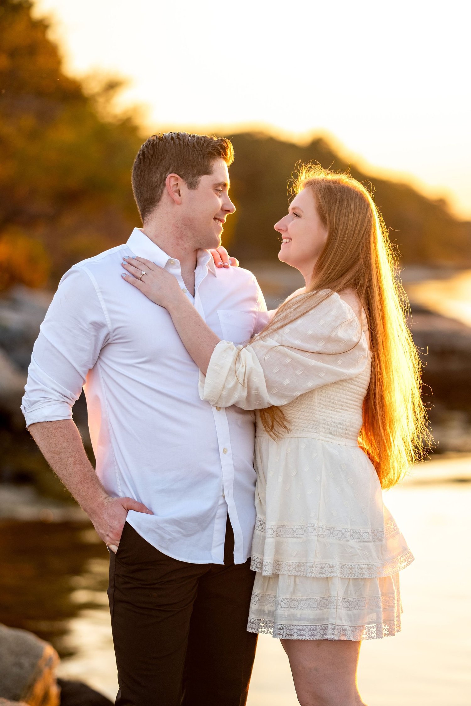 Kayla and Ethan engaged couple coastal sunset portrait rocky shoreline Odiorne Point State Park Rye New Hampshire engagement photography VMG Productions