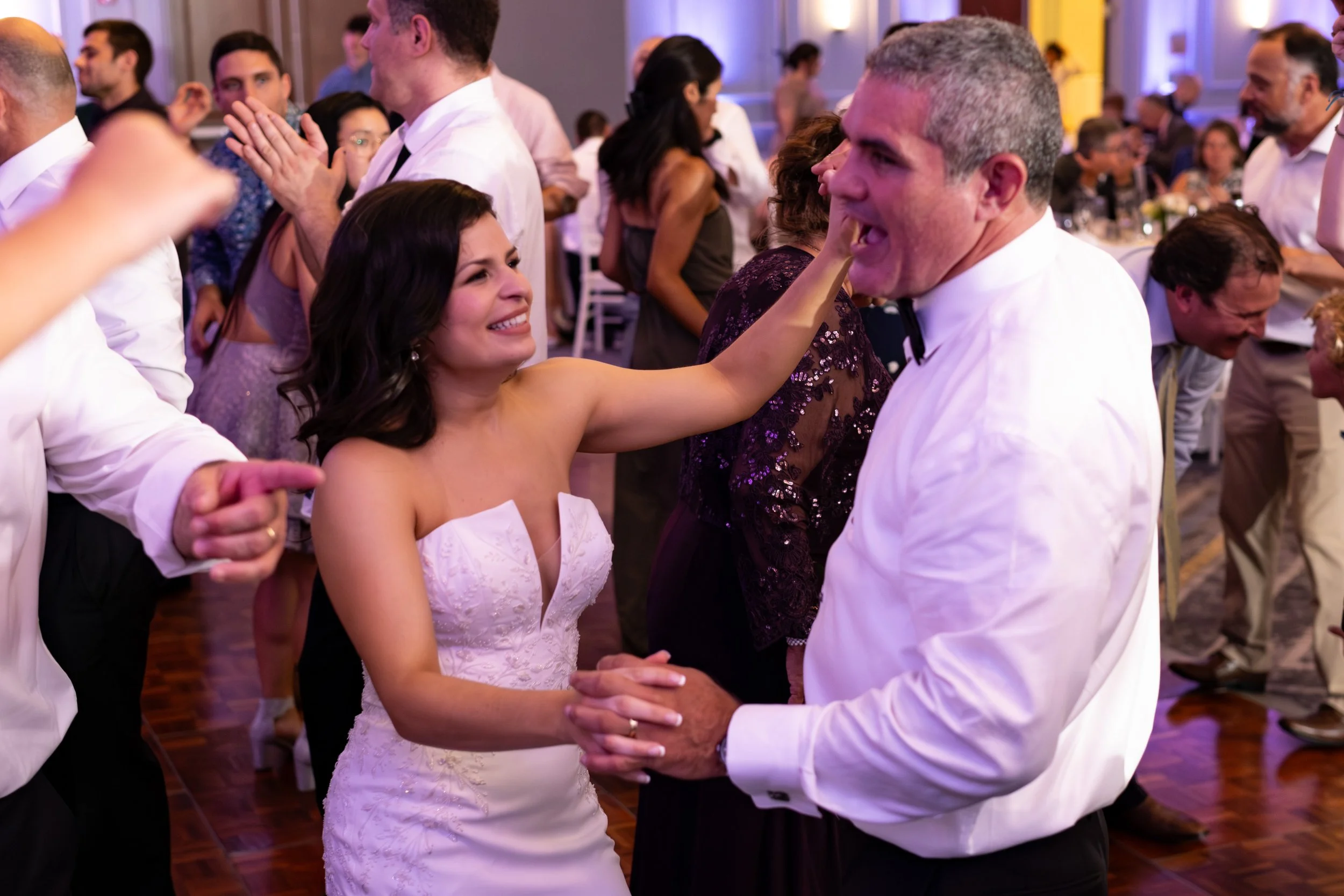 Nicole and Alexey dancing with their guests at Portland Sheraton at Sable Oaks South Portland Maine summer wedding photography VMG Productions