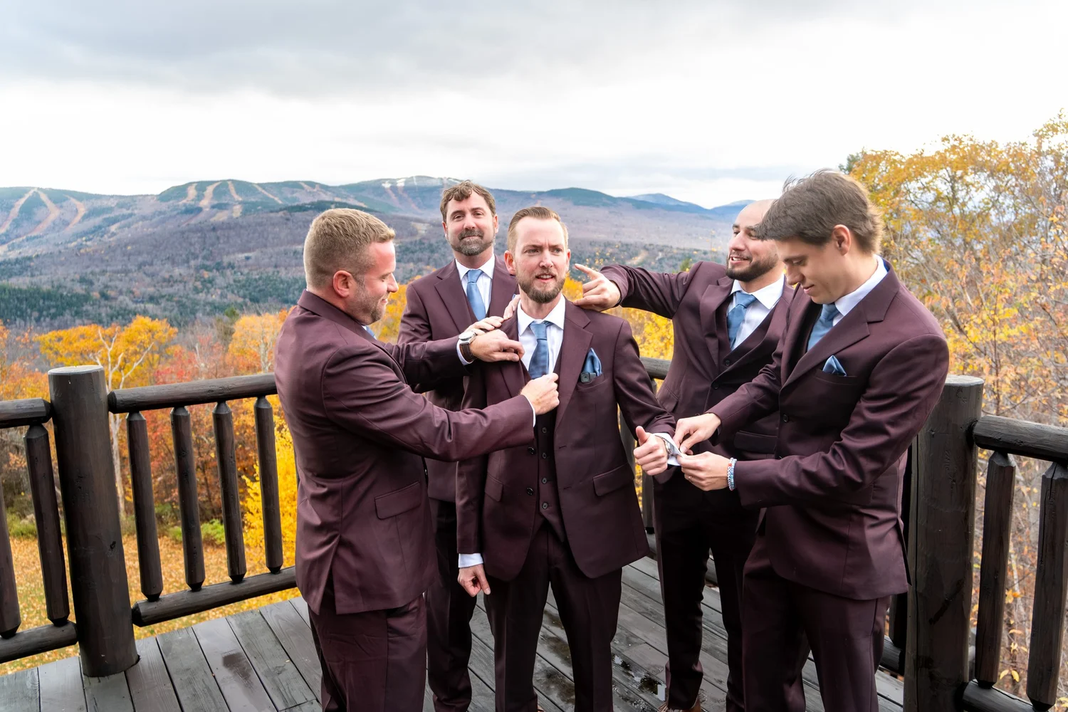 Wedding guests gathered for ceremony on SkiEsta deck mountain backdrop Newry Maine fall wedding VMG Productions