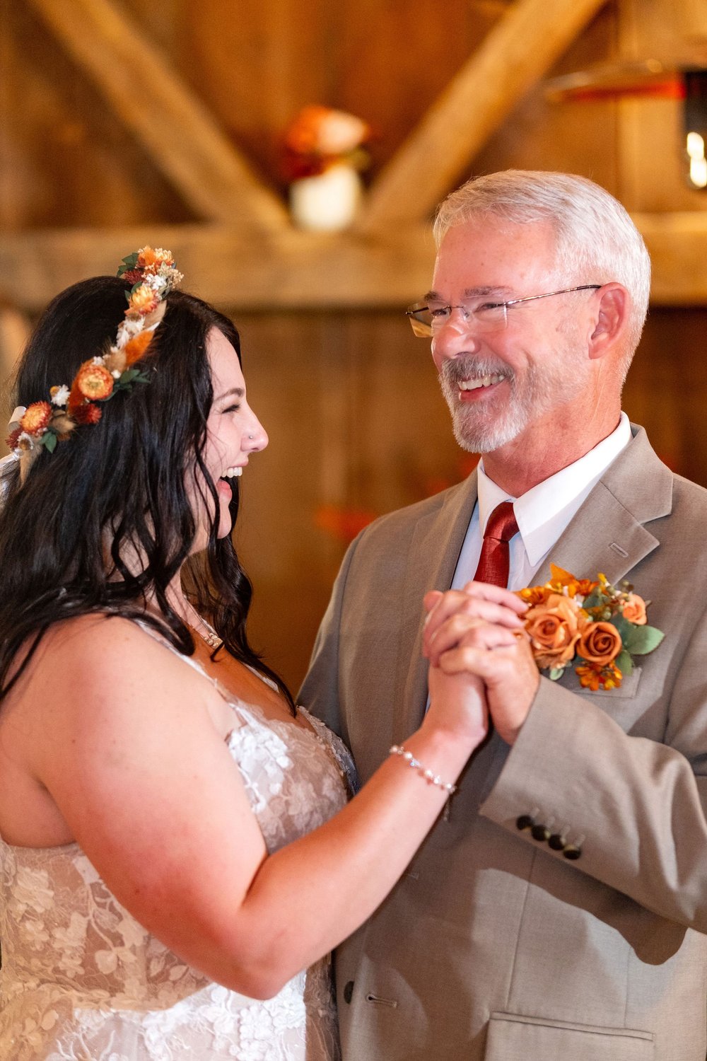 Meagan laughing during father daughter dance at The Watson Homestead Hiram Maine fall wedding photography VMG Productions