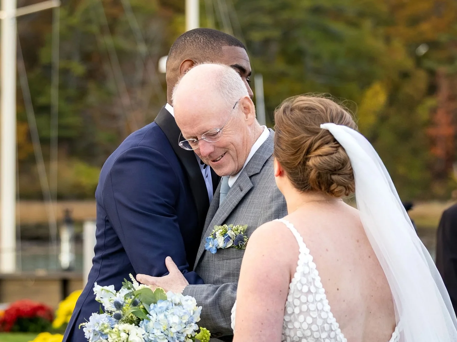 Kaitlyn and father emotional hug during ceremony Nonantum Resort Kennebunkport Maine fall wedding photography VMG Productions
