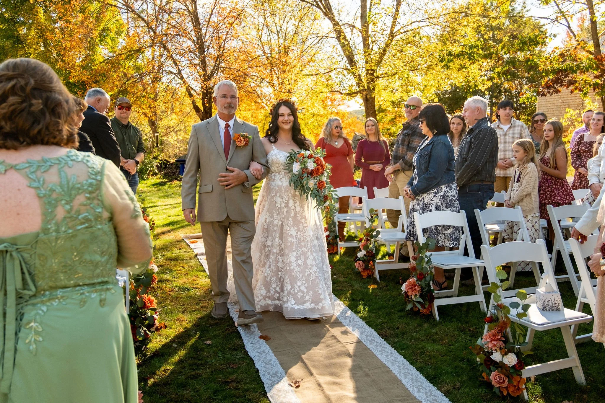Meagan walking down outdoor aisle with her father at The Watson Homestead Hiram Maine fall wedding photography VMG Productions