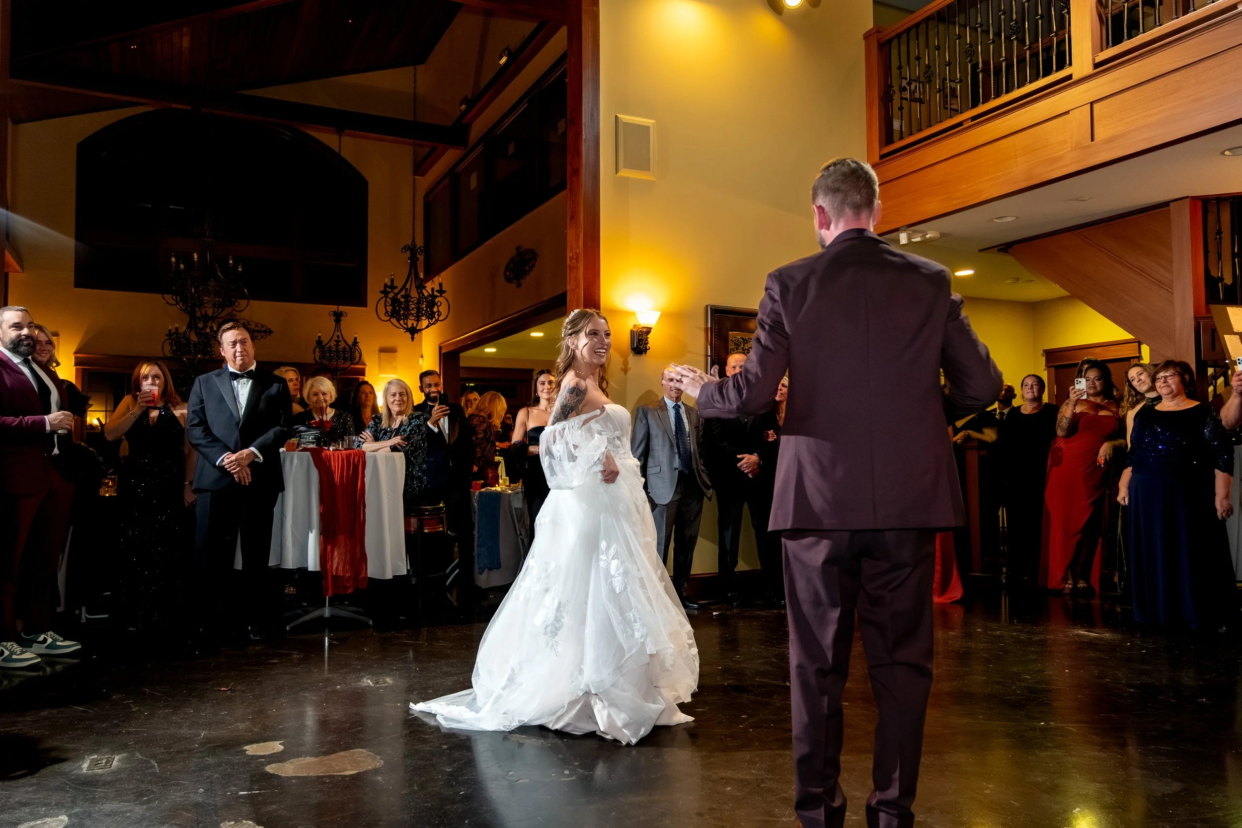 Sarah and Steve first dance wide shot guests watching SkiEsta grand hall Newry Maine fall wedding VMG Productions