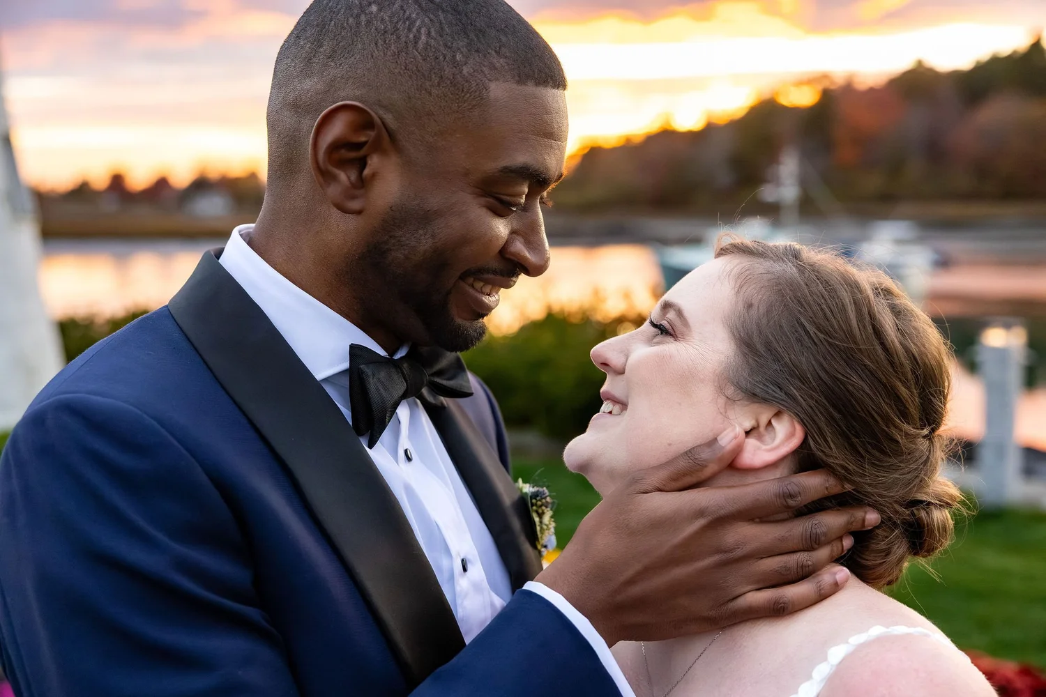 Kaitlyn and Darren close up smiling at each other golden hour Kennebunkport Maine fall wedding photography VMG Productions
