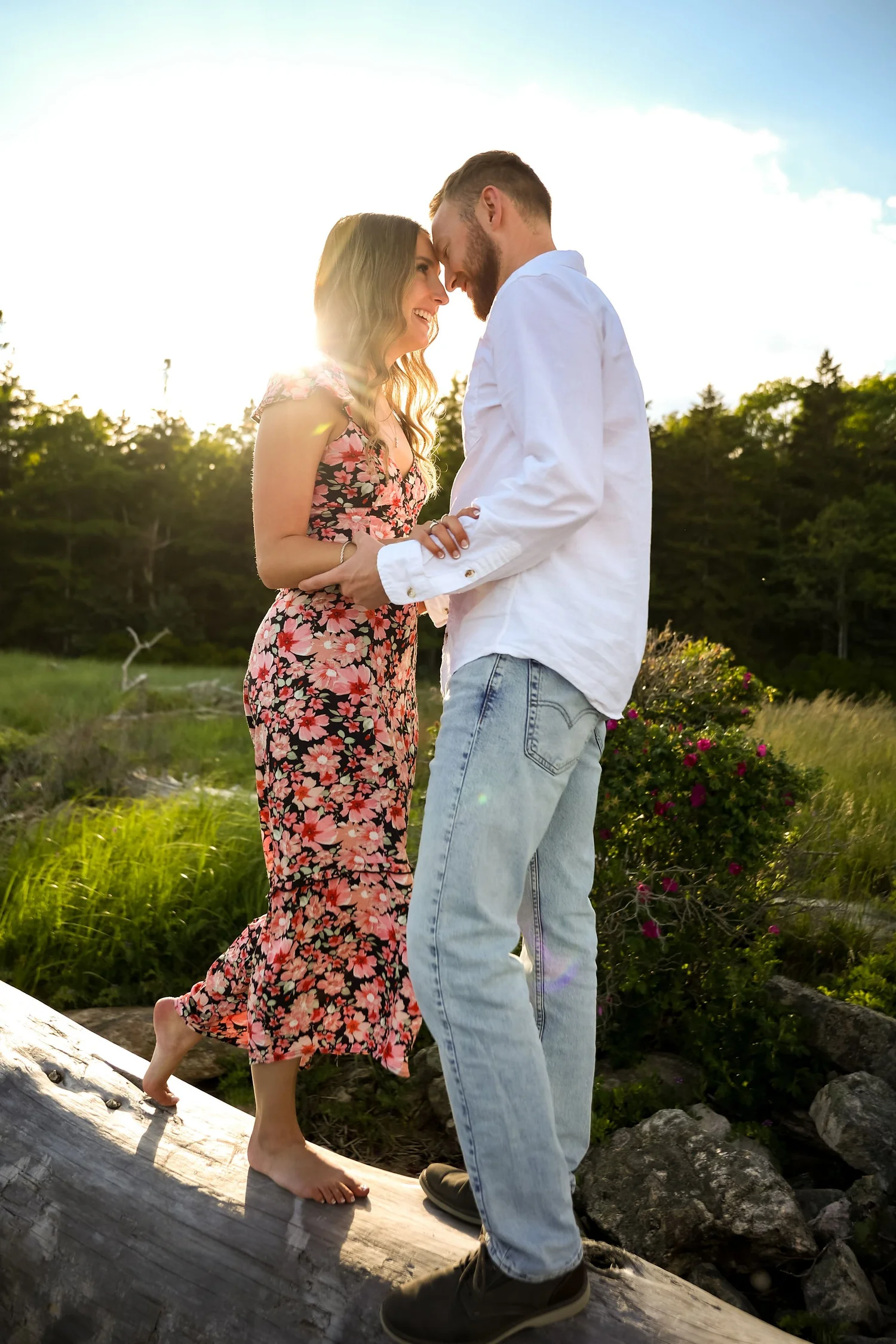 Engaged couple among the rocks at Reid State Park, Georgetown, Maine, by VMG Productions