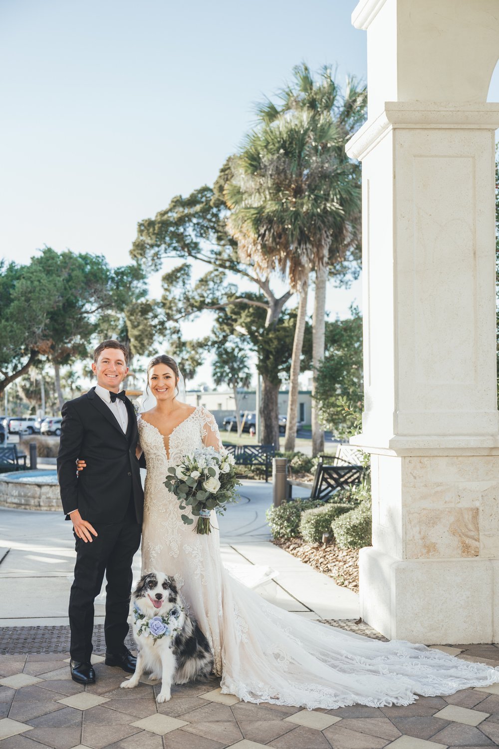 Southern Palms Studio couple poses with dog after wedding at River House in Jacksonville, FL.jpg