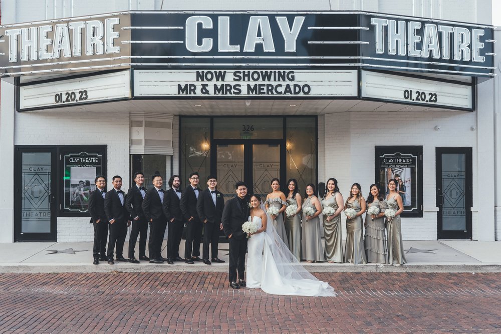 Southern Palms Studio couple poses outside of The Clay Theatre in St. Augustine, FL following wedding ceremony.jpg