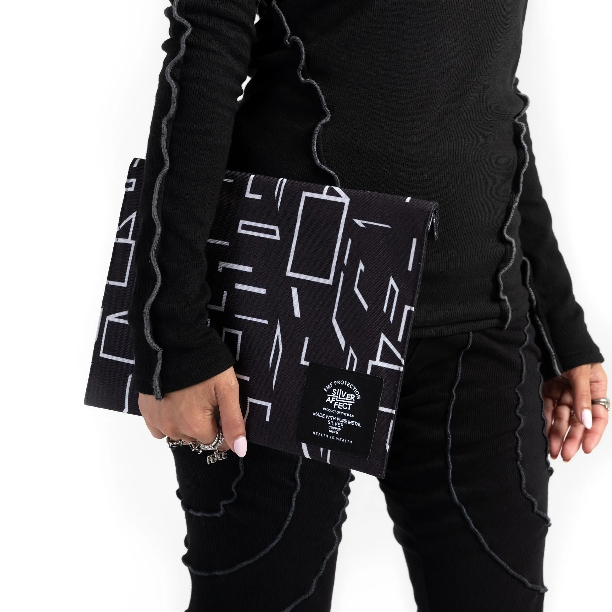 model-holding-techwear-emf-blocking-pouch_1024x1024@2x.jpg