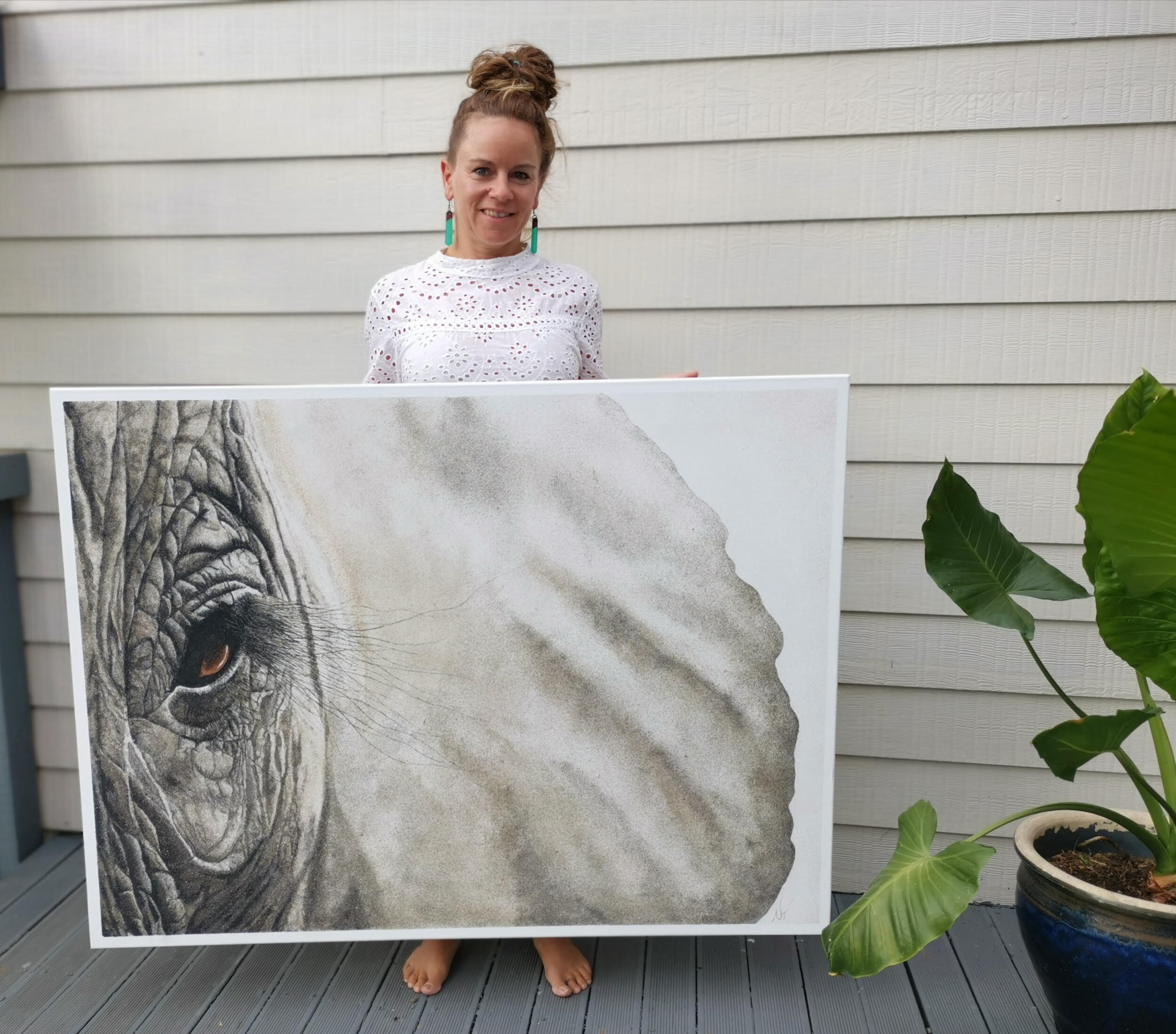 Nancy with one of her elephant images WITH EYES WIDE OPEN an image she created for howmanyeleohants a charity she works with in collaboration to safe the african elephants.jpg