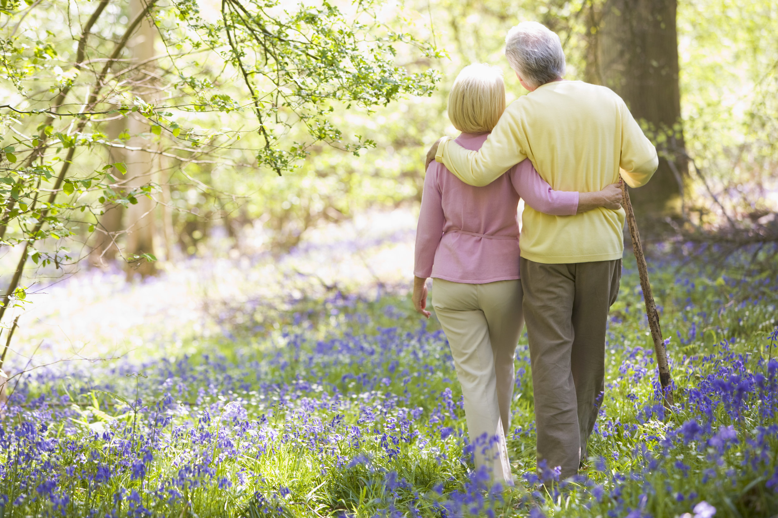 Older Couple Walking with Cane.jpeg
