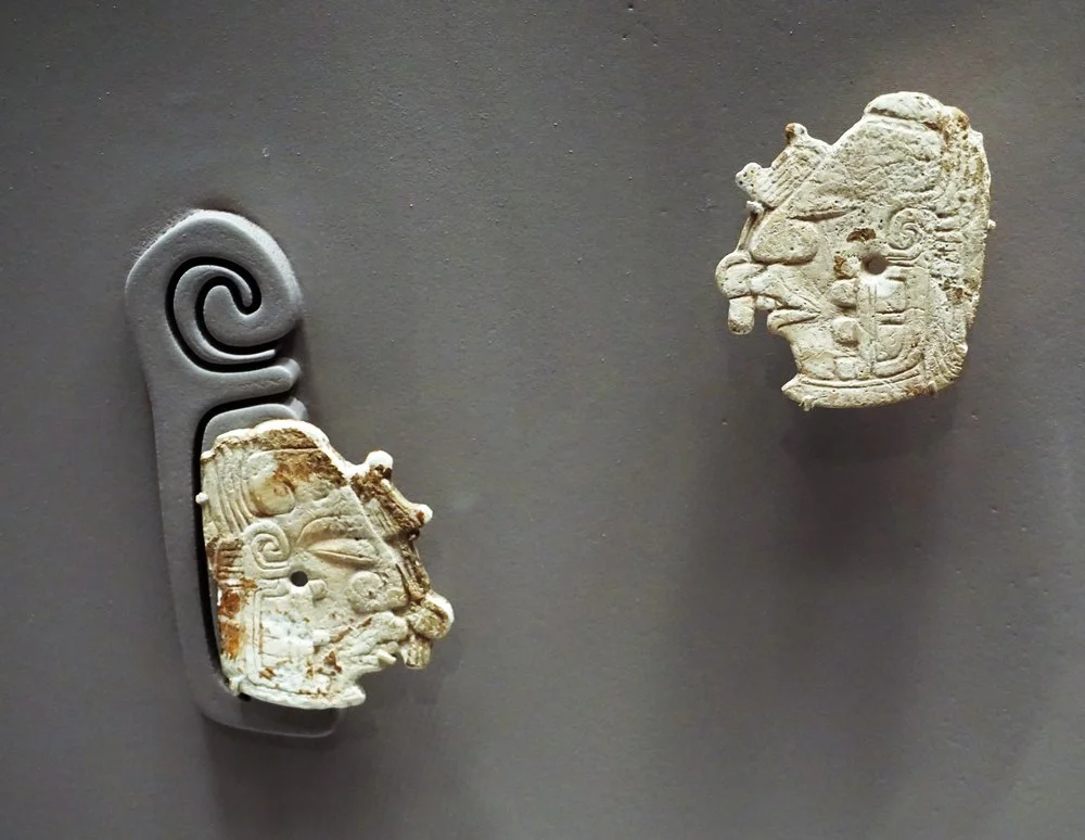 Pair of Earflare Frontals, 5th-7th century, Shell. Wispering into the ear of the king.