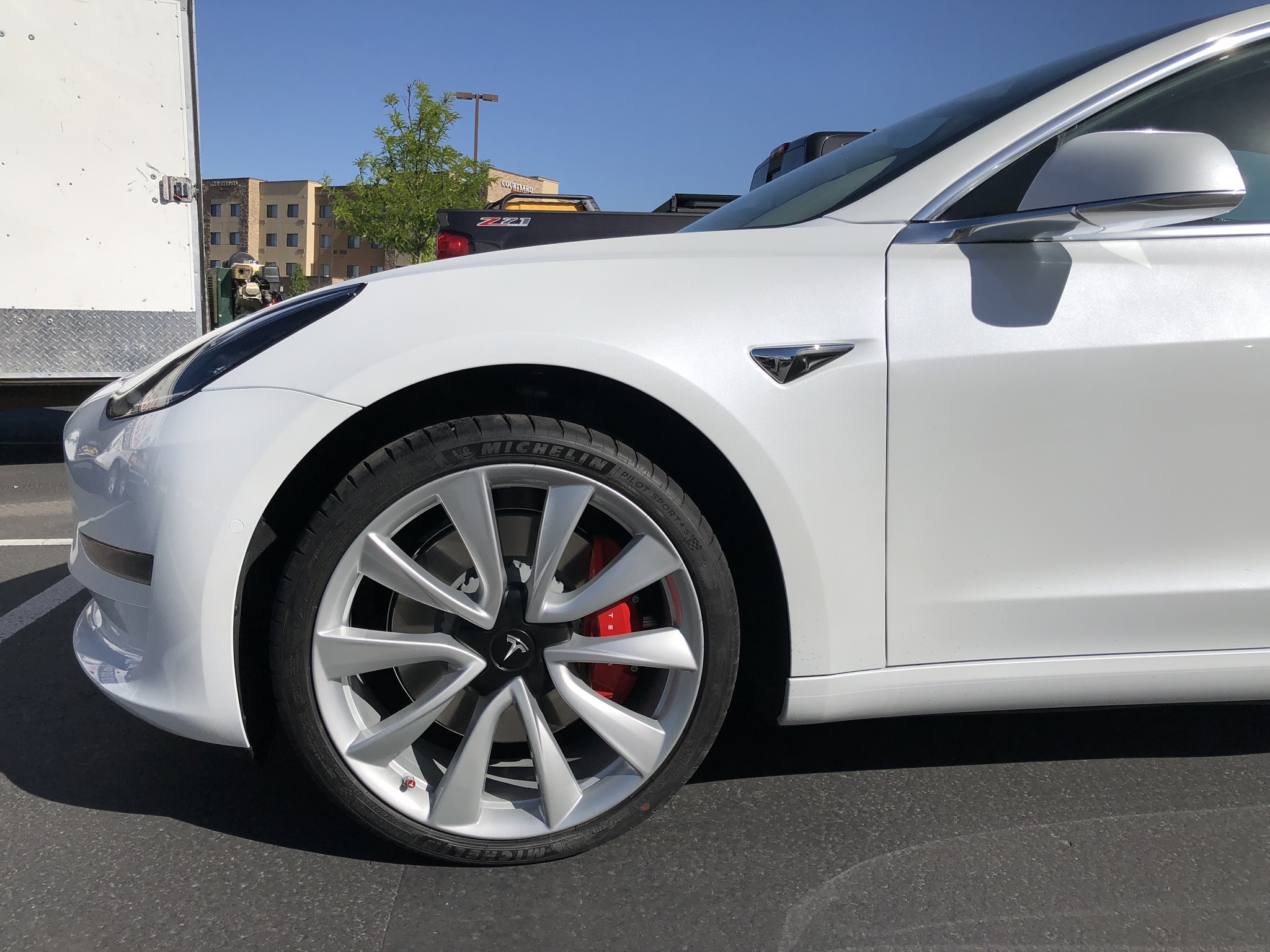 Tesla Model 3 after white wheel painting CU