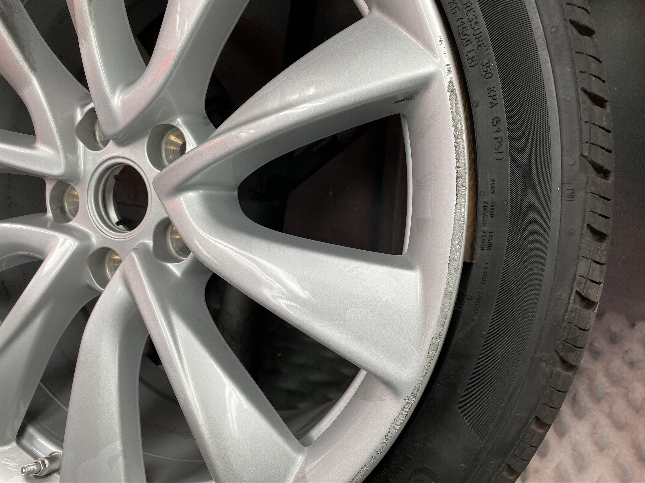 Tesla Model 3 before curb rash wheel repair