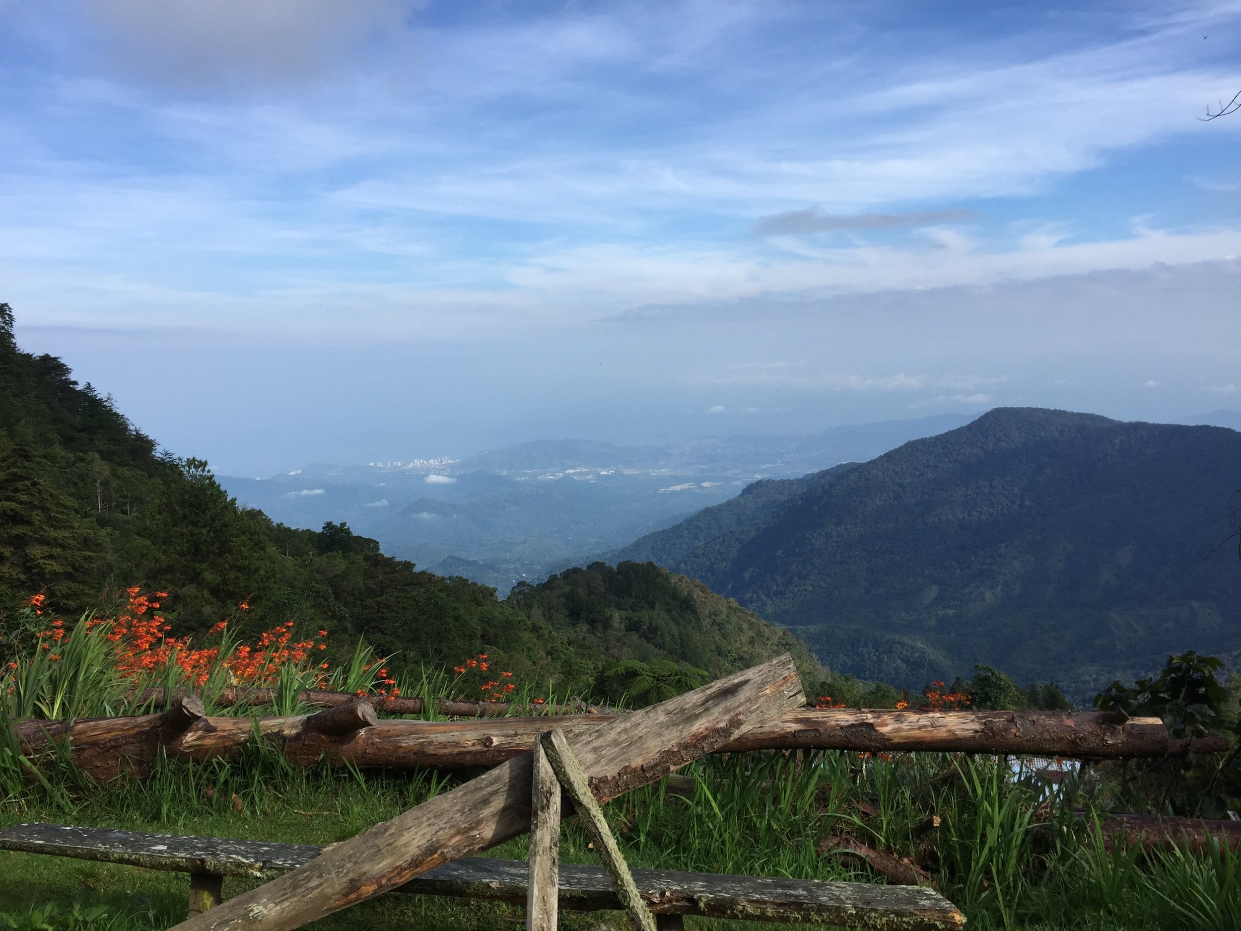  CERRO KENNEDY, COLOMBIA – JULY 28TH, 2017: The view from 8000 feet above sea level, just outside the gate to the San Lorenzo weather monitoring station. The city of Santa Marta sits in the distance where I arrived by plane three days prior.  
