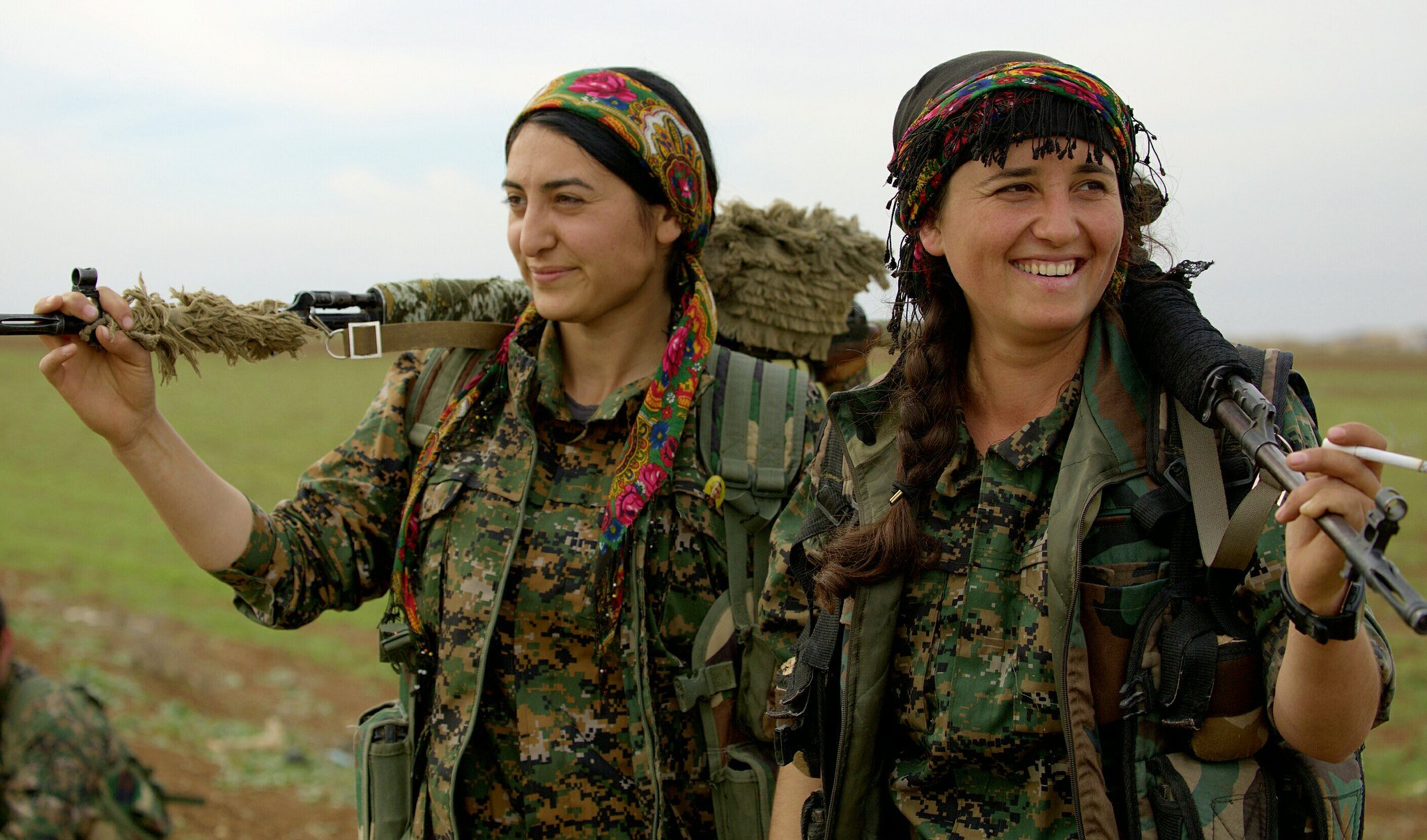 PICTURED: Two Female Kurdish YPG fighters smile for the camera. Kurdish peoples are known to be more progressive than the societies in which they live, which includes their attitudes towards women’s rights. Photo Credit Kurdish struggle, CC 2.0.