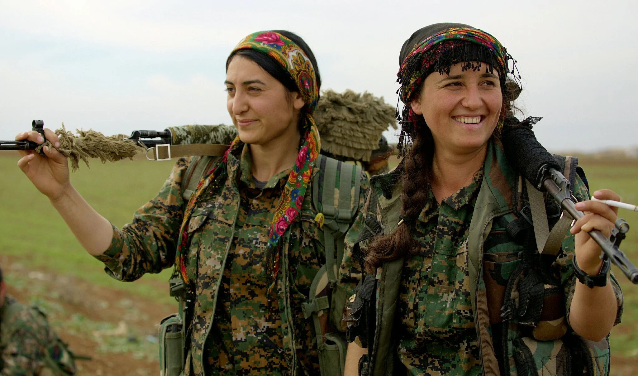 PICTURED: Two Female Kurdish YPG fighters smile for the camera. Kurdish peoples are known to be more progressive than the societies in which they live, which includes their attitudes towards women’s rights. Photo Credit Kurdish struggle , CC 2.0.