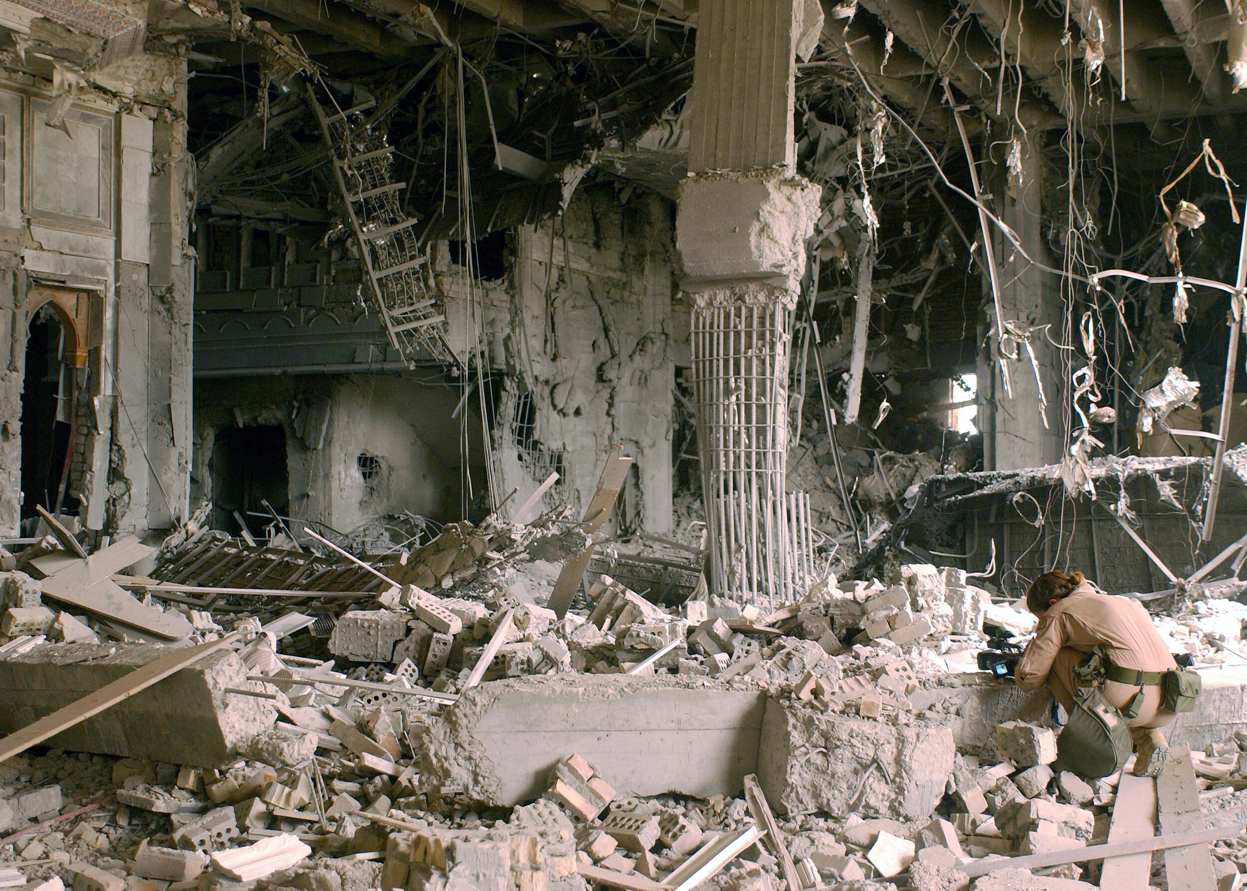 April 25th, 2003. PICTURED: A photographer captures an image of the remains of the Baath Army headquarters in Baghdad. Photo credit SSGT Cherie Thurlby. CC. 2.0