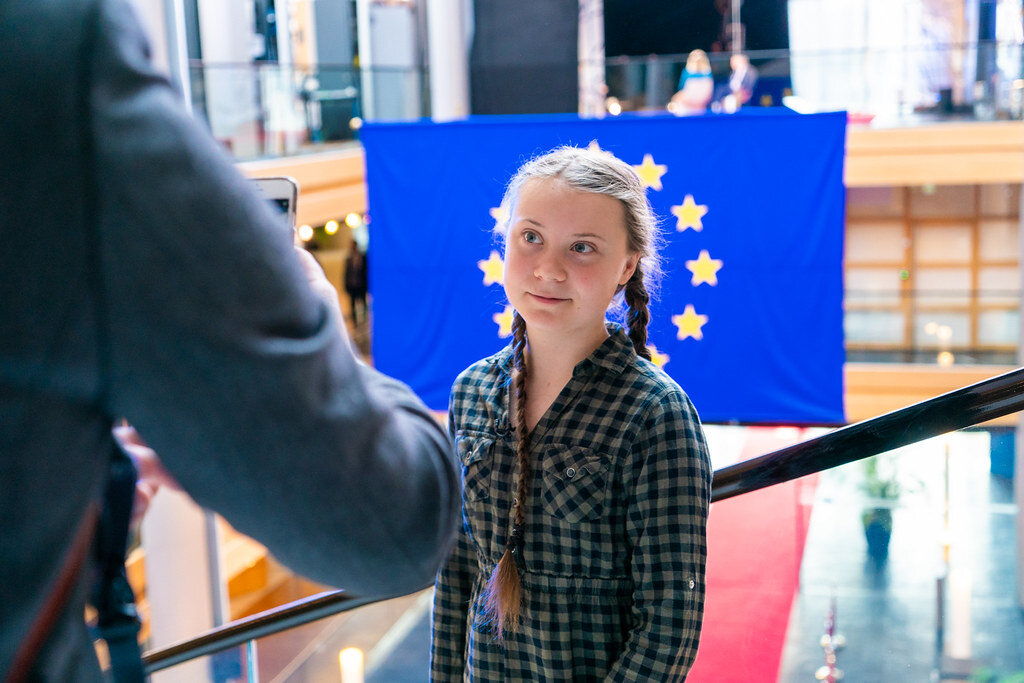 PICTURED: Swedish climate activist and Time Magezine’s Person of the Year 2019, Greta Thunberg is offered a handshake on a visit to the European Parliament. Photo credit European Parliament. CC 2.0
