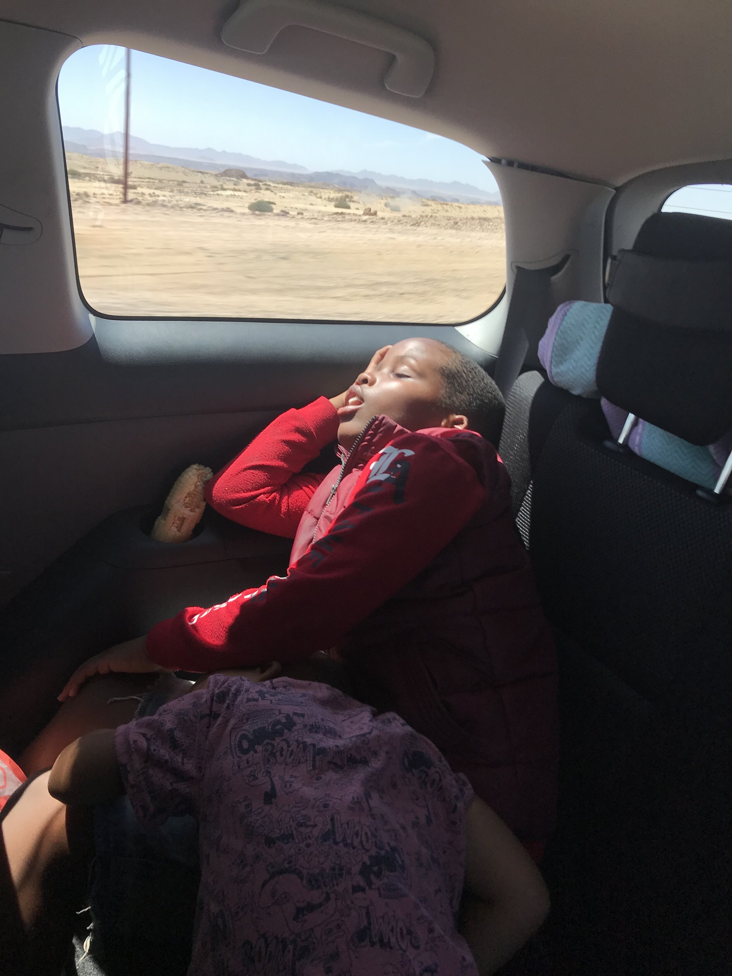 More of the locals - two boys taking a nap on the 4-hour bus ride back to Windhoek. 