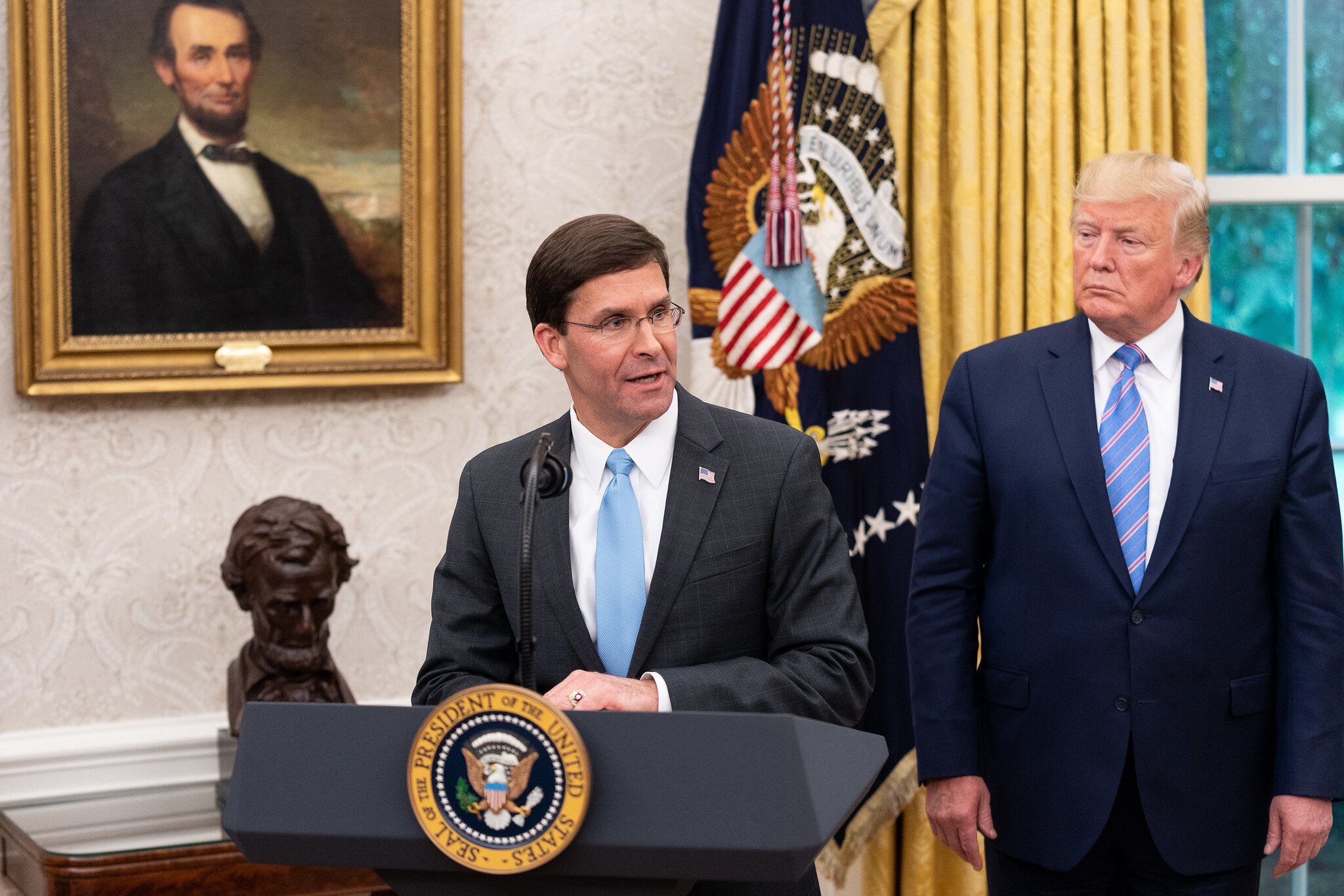 WASHINGTON, July 23rd, 2019. PICTURED: President Donald J. Trump watches as new Secretary of Defense Mark Esper delivers remarks in the Oval Office of the White House.