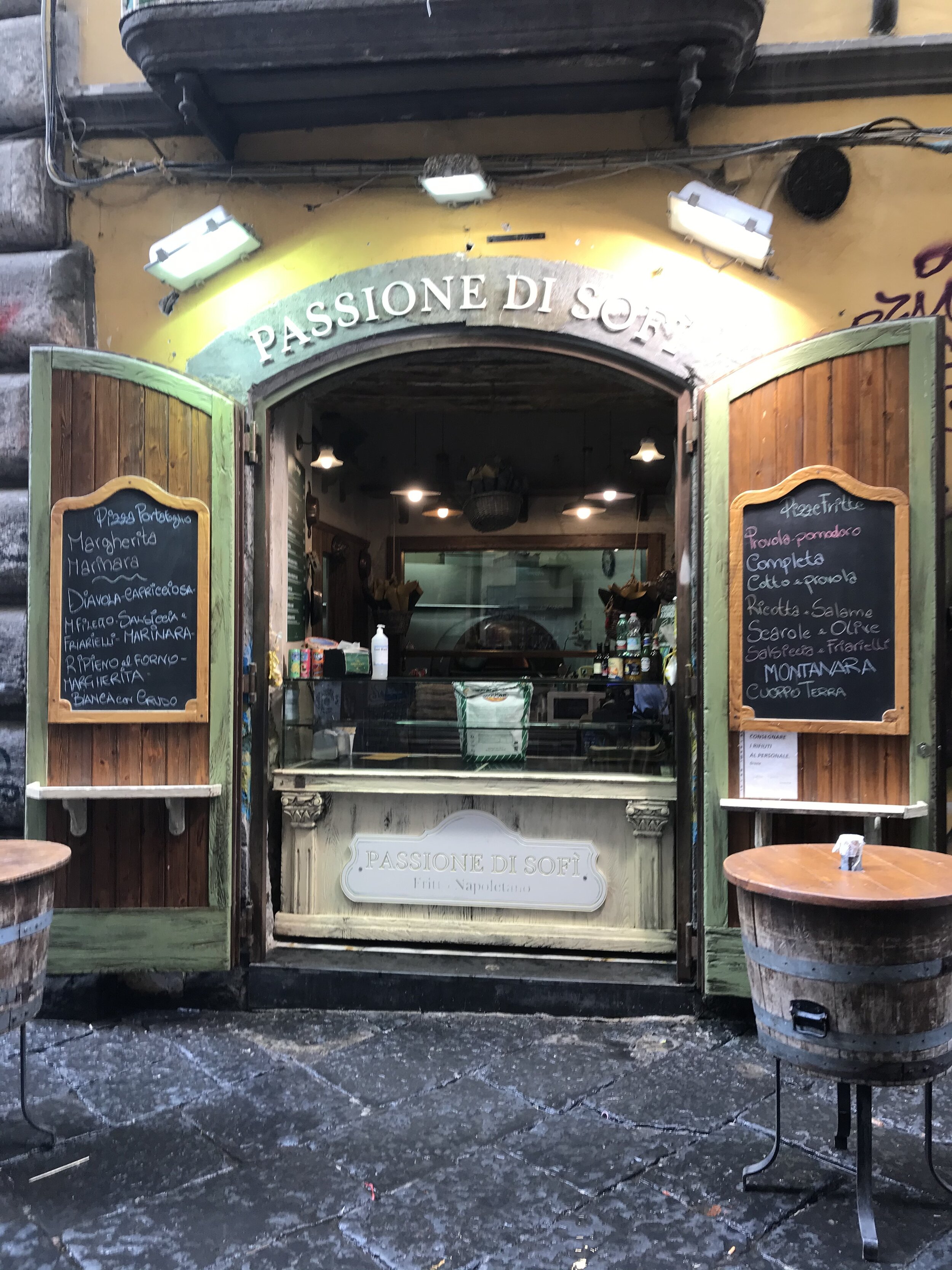   PICTURED:  It’s not always produce stores, but also tiny eateries like this one which line Spaccanapoli.  