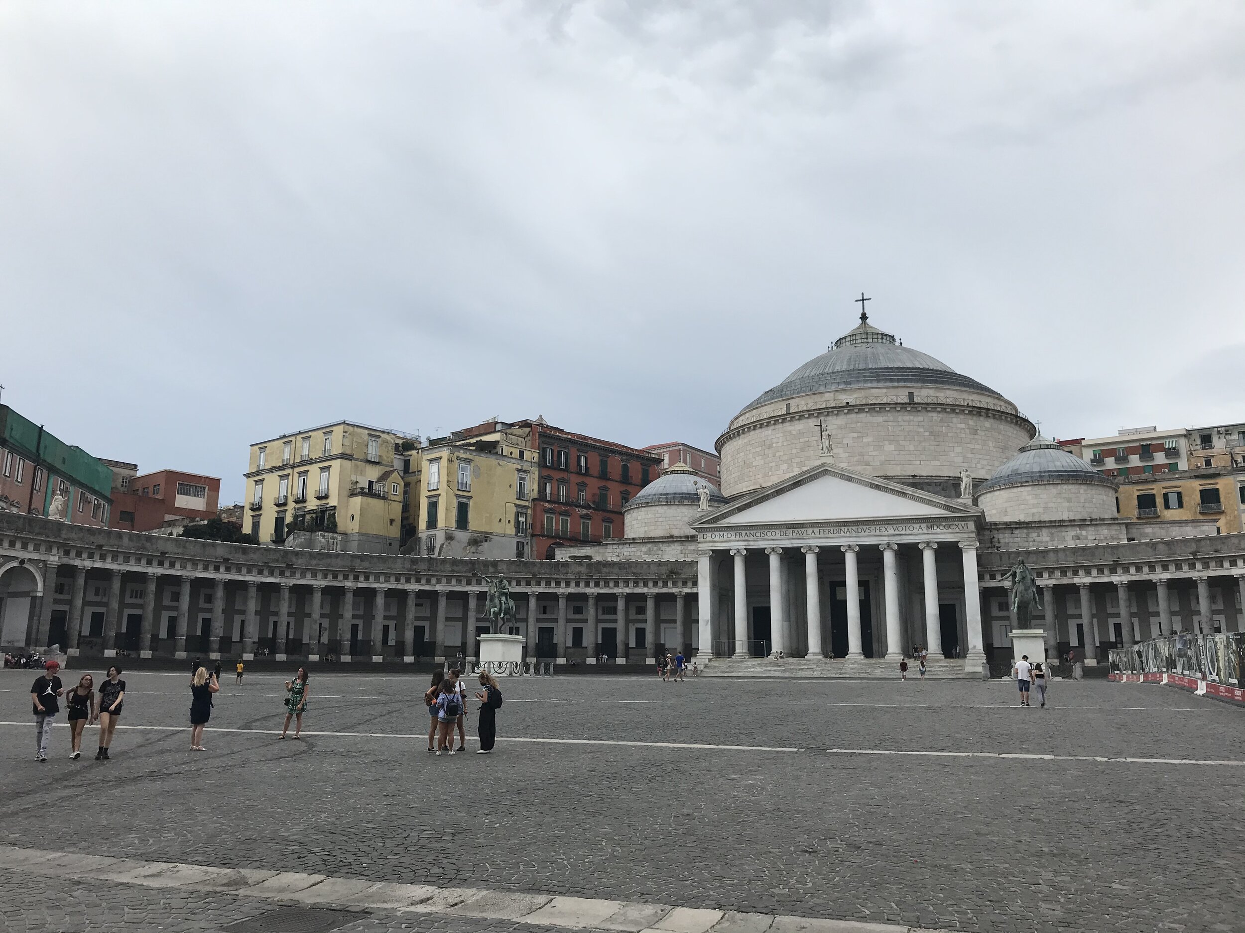   NAPLES, Italy. August 7th, 2020. PICTURED:  Piazza Plebiscito yawns as a church modeled after the Roman Pantheon stares endlessly at the royal palace across the plaza. 