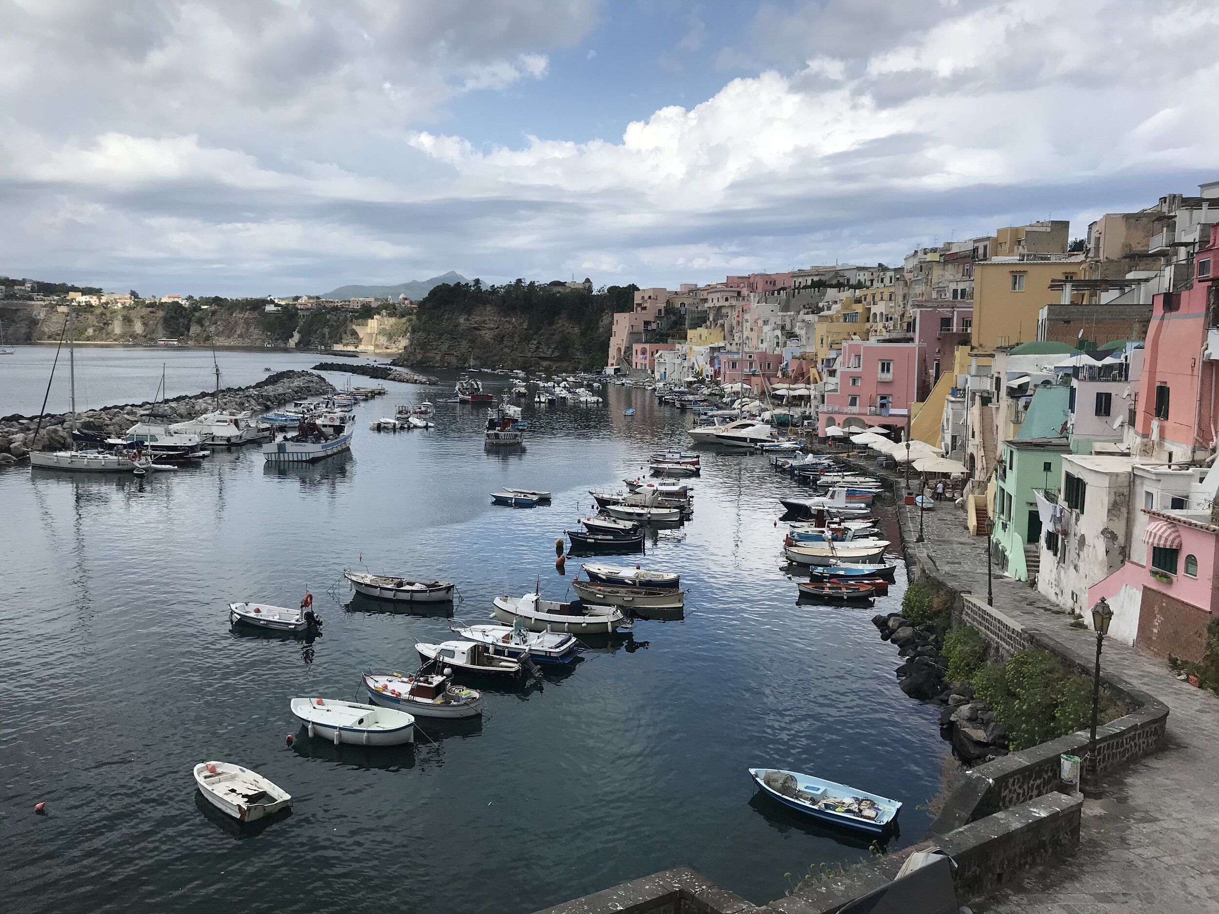  PROCIDA, Napoli. August 5th, 2020. PICTURED: The other side of Procida from where the ferries arrive, a thousand painted houses are bisected by a thousand tiny staircases. 