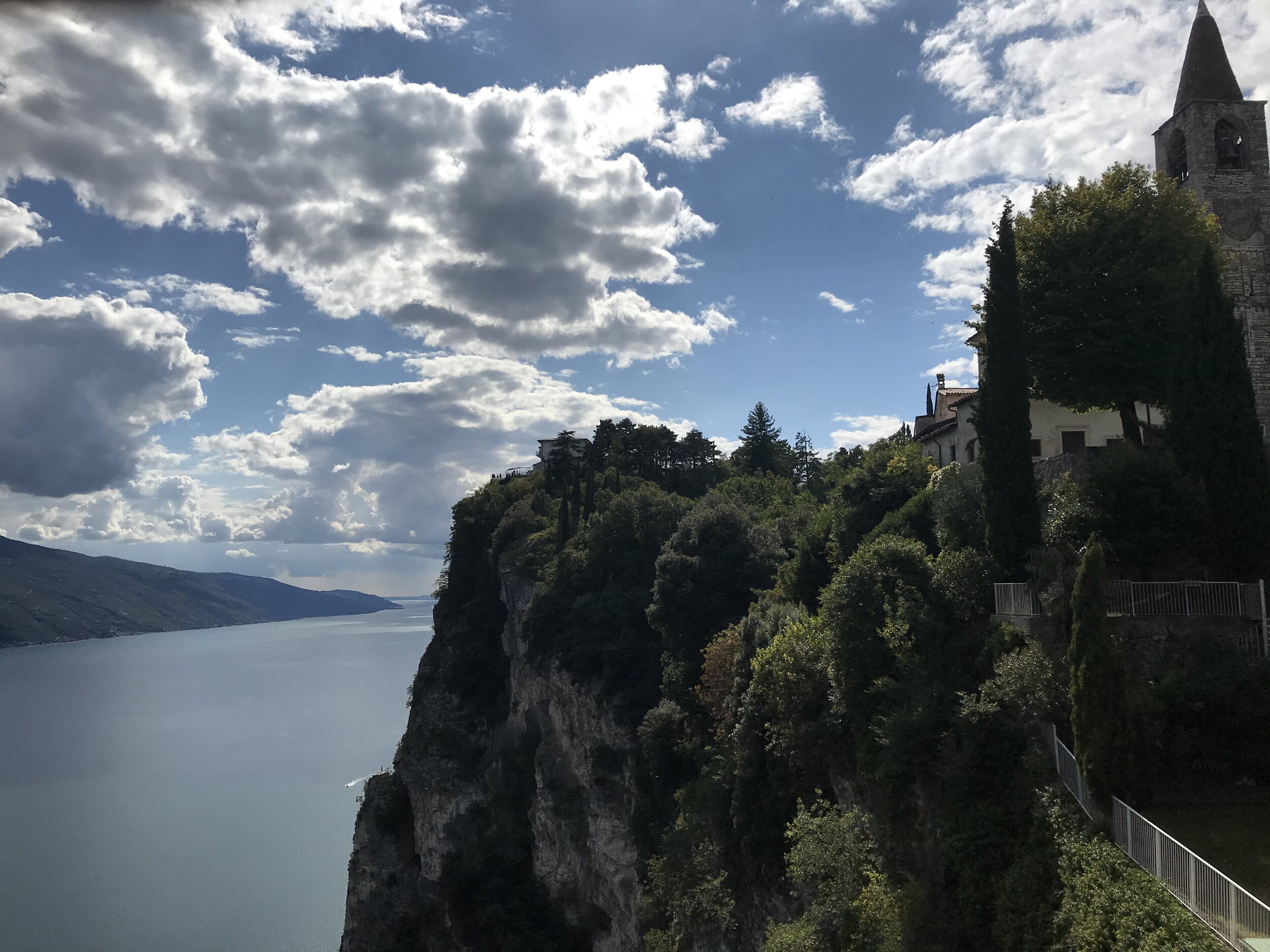   PICTURED:  The view from a cafe down to the lake below, where many bikers sat to have a drink and enjoy the sunny afternoon.  