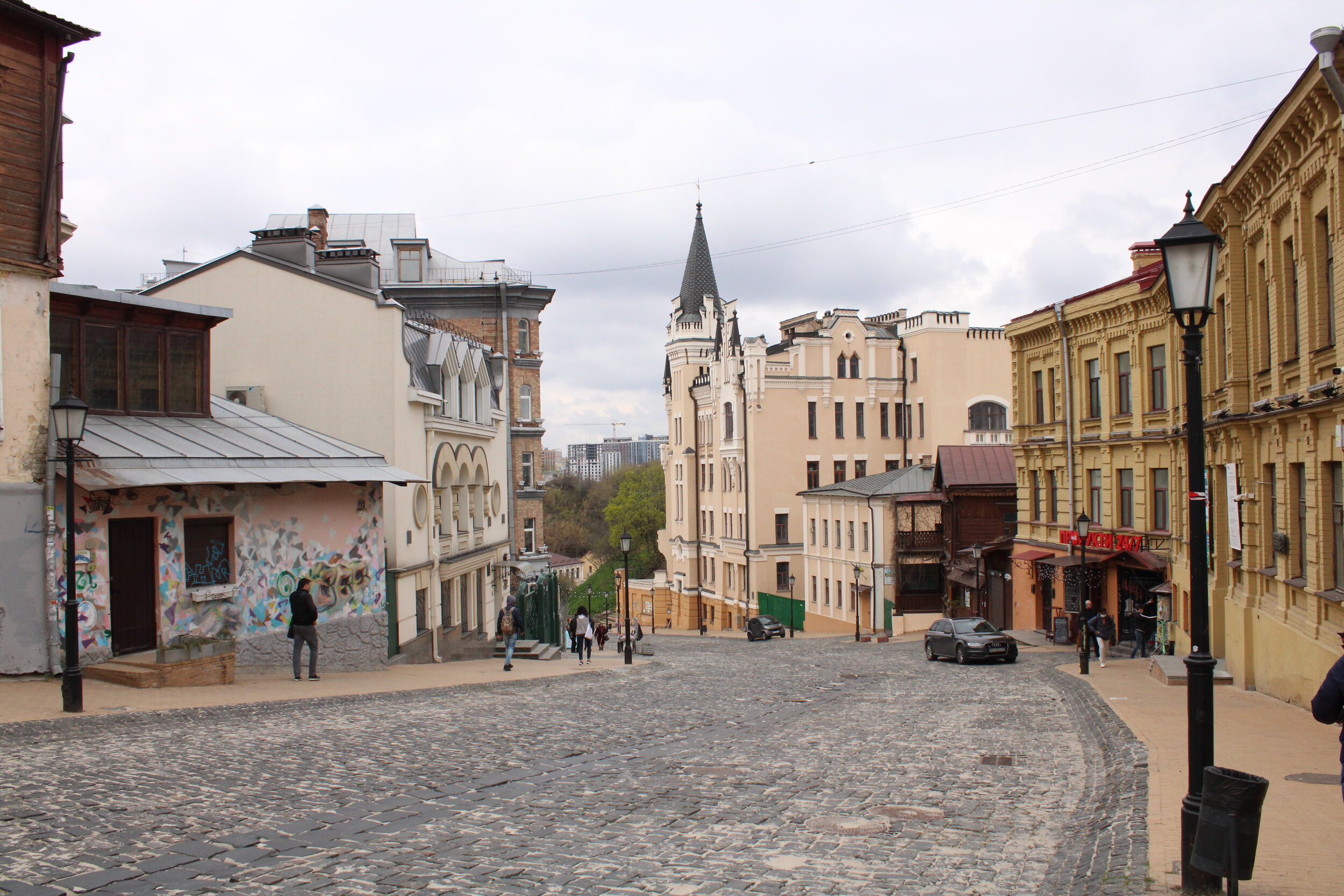  KYIV, Ukraine. April 20th, 2021. PICTURED: A view down the road called Andriyivsky’s Descent, above the Podil neighborhood. Photo credit: Andy Corbley ©. 