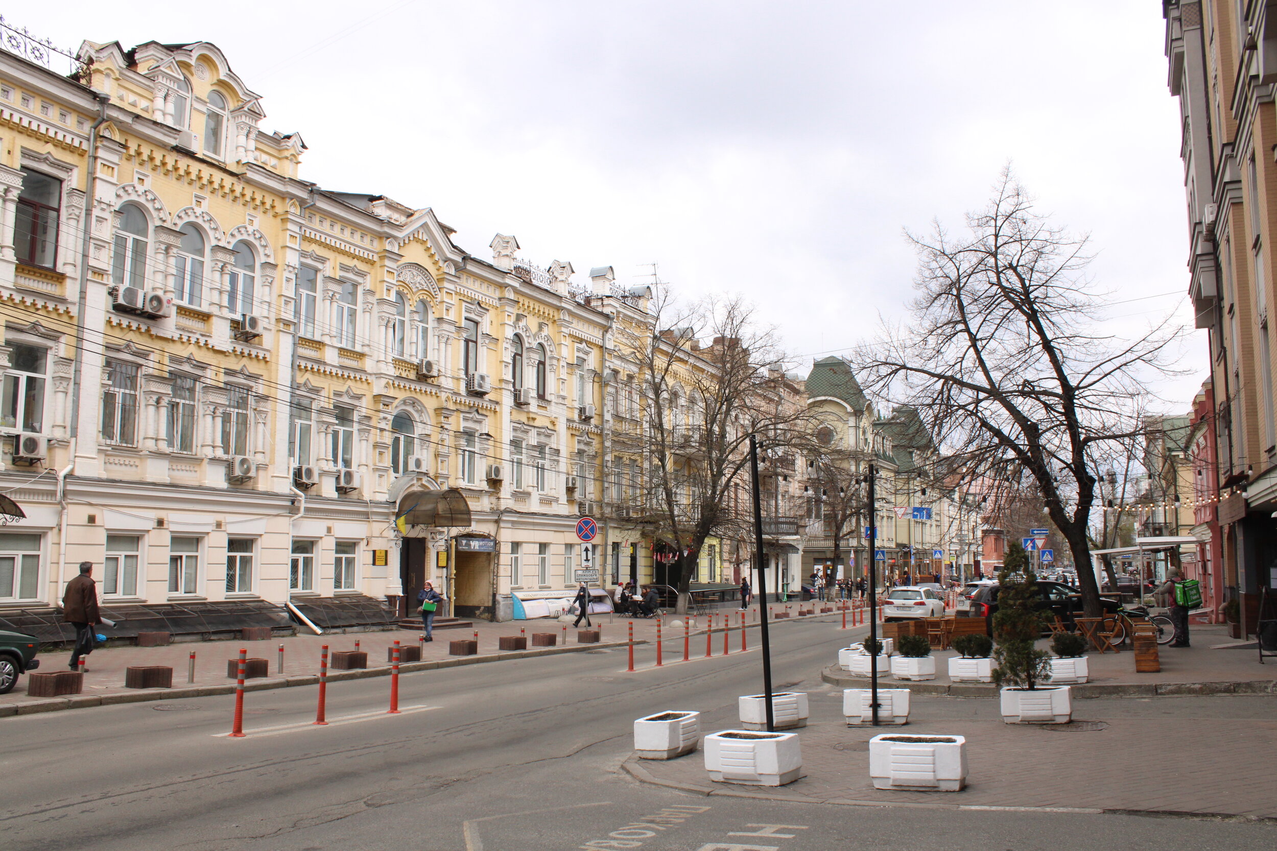  KYIV, Ukraine. April 19th, 2021. PICTURED:  A boulevard in the oldest neighborhood in Kyiv, lined with colored-brick buildings and chestnut trees. 