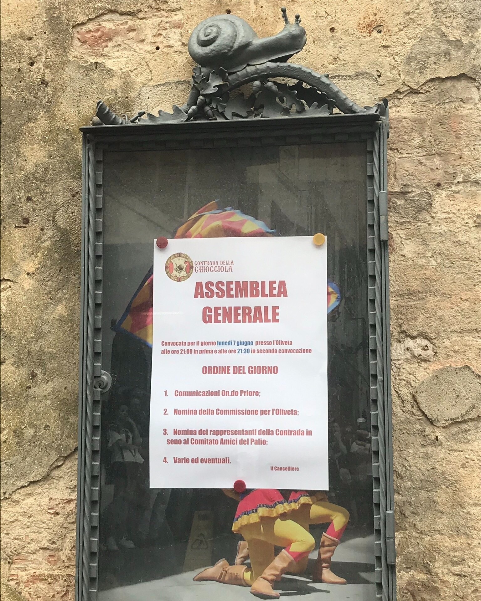  SIENA, Italy. June 4th, 2021. PICTURED: The small details that alert the traveler to the uniqueness of Siena, as a flyer advertising a general meeting of one of the contrada sits on the side of the street. 