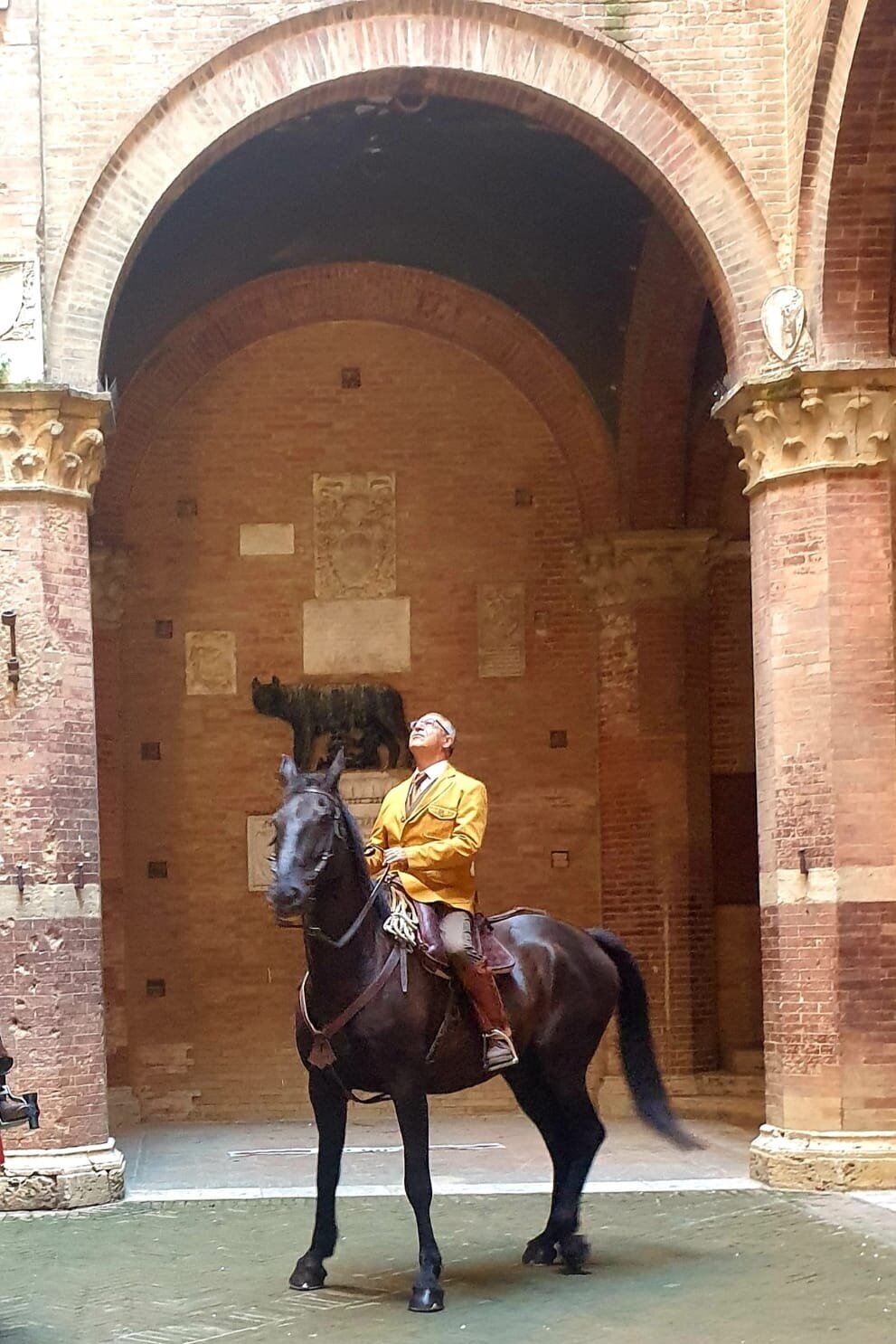 PICTURED: My friend Carlo Barberi, in the colors of a captain of his contrada, preparing to lead his men out into the Piazza del Campo.