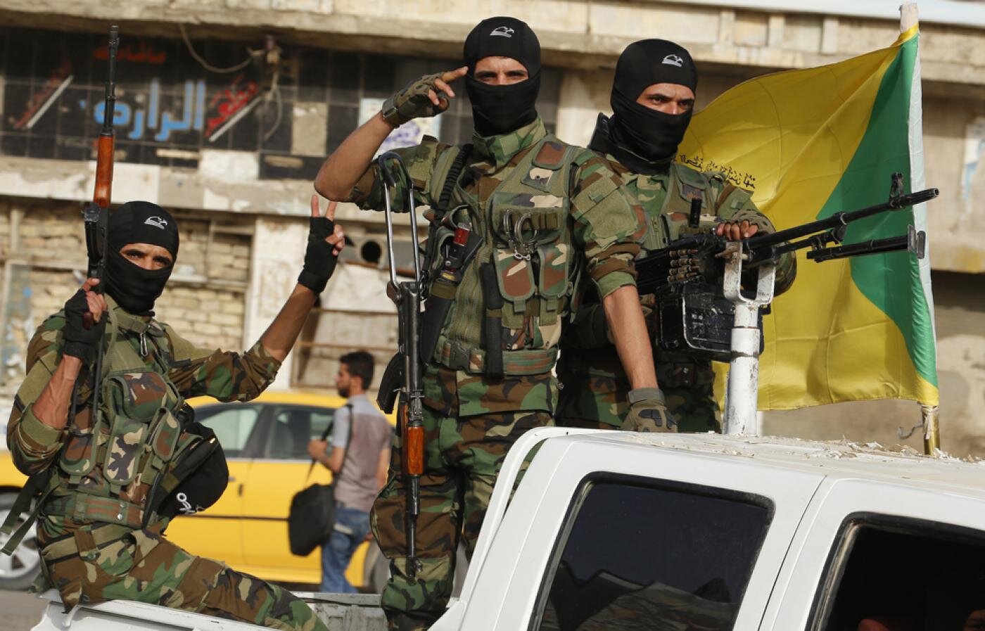 PICTURED: Members of Iraq’s Kataeb Hezbollah militia. Photo credit: AFP. Fair Use.