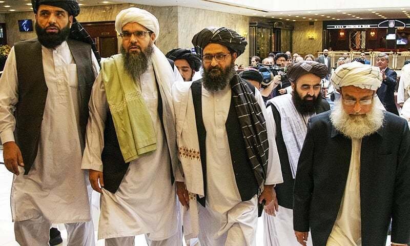 MOSCOW, Russia. May 28th, 2019: PICTURED: Mullah Abdul Ghani Baradar, third from left, arrives with other members of the Taliban delegation for talks in Moscow. PC: AP. Fair Use.