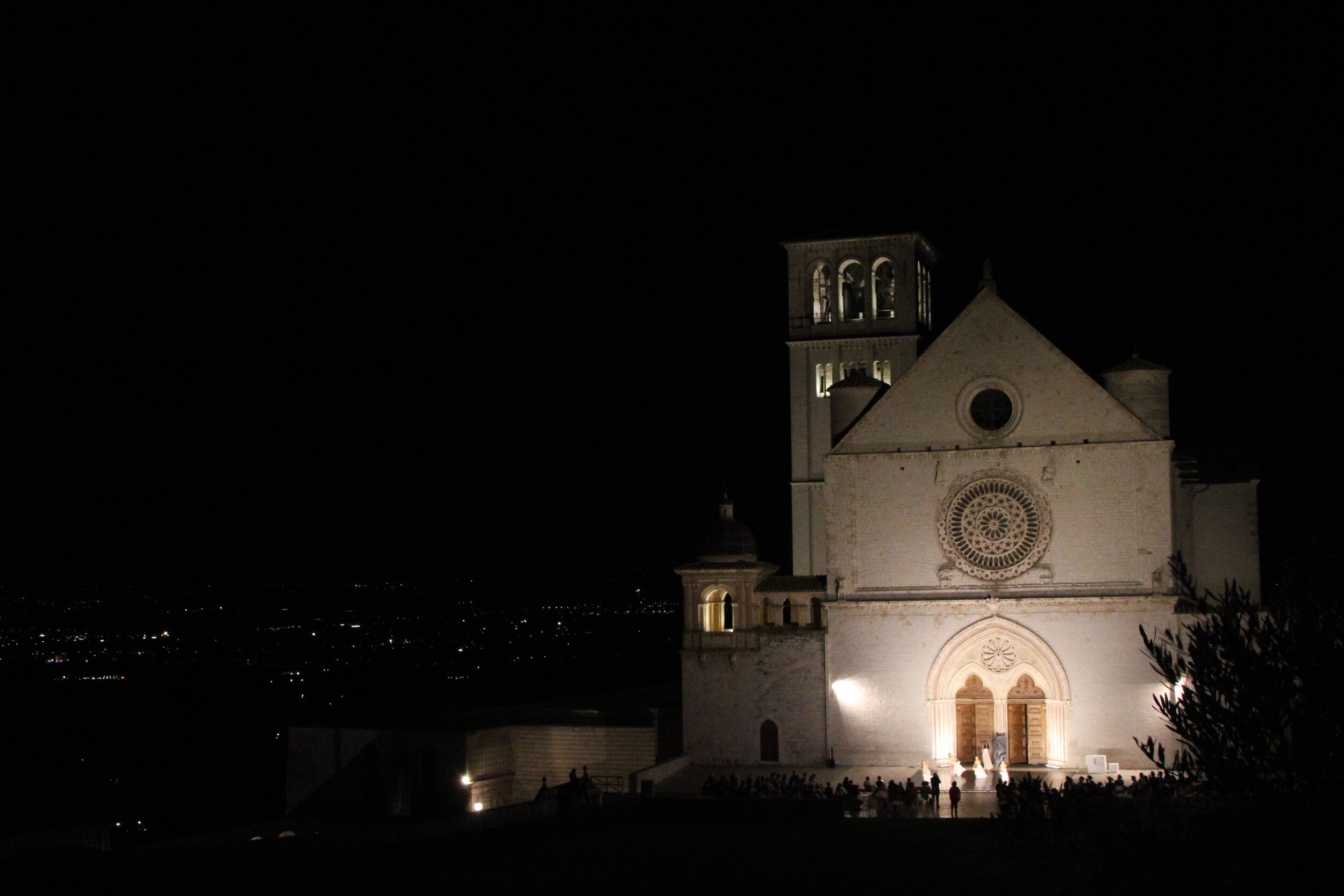   PICTURED:  A night-ballet troupe performs on the steps to Saint Francis’ Basilica. 