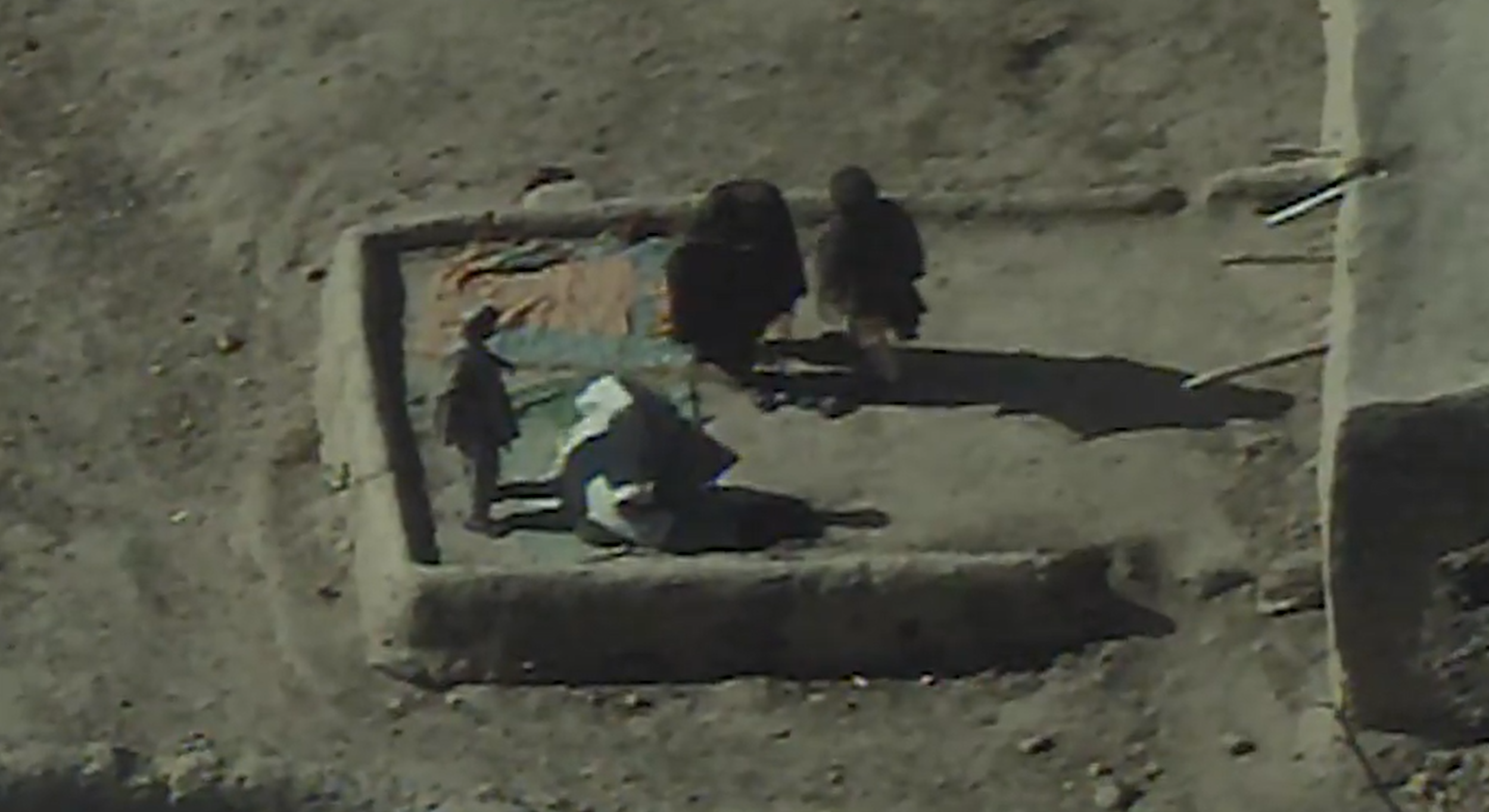 PICTURED: Drone footage of a group of unarmed people, likely in Helmand Province, Afghanistan, taken before they were killed by drone bomb. PC: Jack Murphy, Connecting Vets.