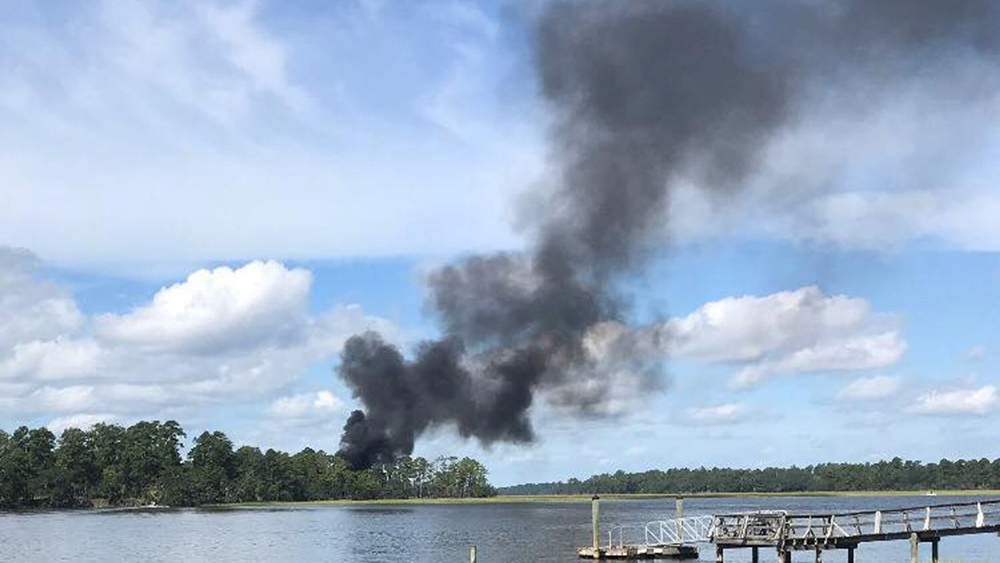 PICTURED: Smoke rises at the site of the F-35 jet crash in Beaufort, South Carolina. PC: Sky News.