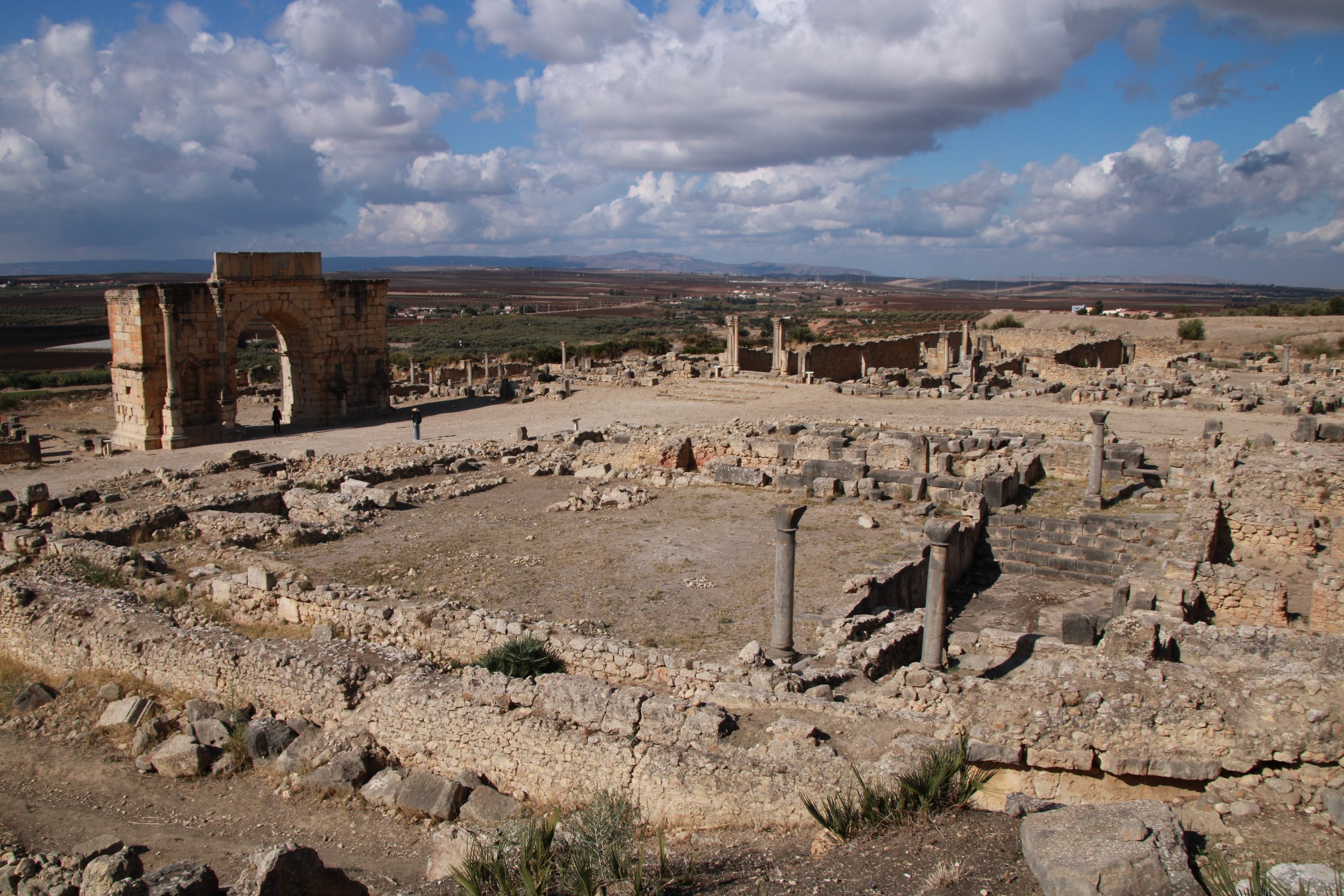  PICTURED: The sun finally breaks during a cloudy November day on the 3rd century Roman ruins of Volubilis, near Meknes. PC: Andrew Corbley © 