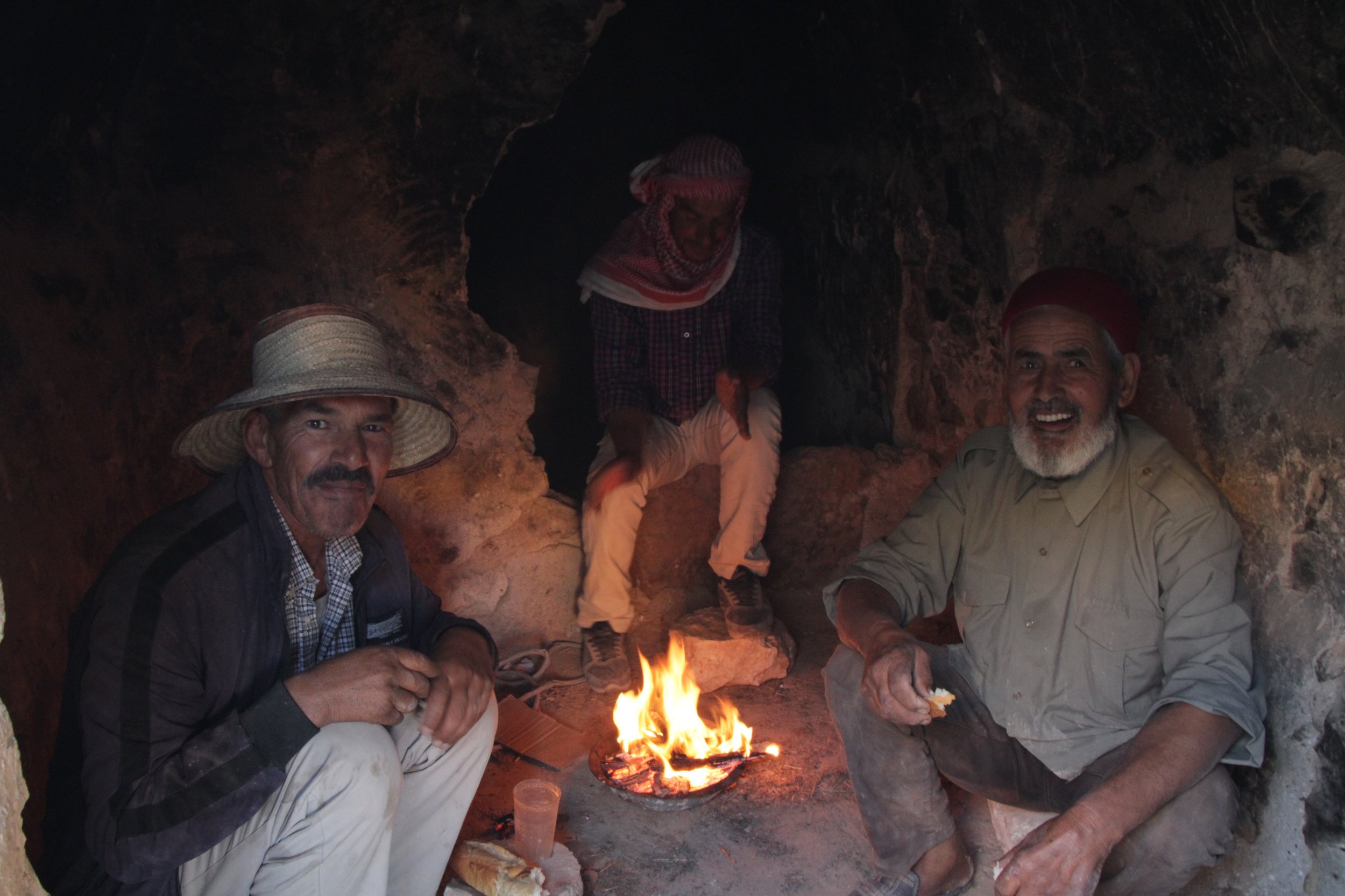  NOVEMBER 19th, 2022. PICTURED: Three men have breakfast inside a Ghorfa. PC: Andrew Corbley © 