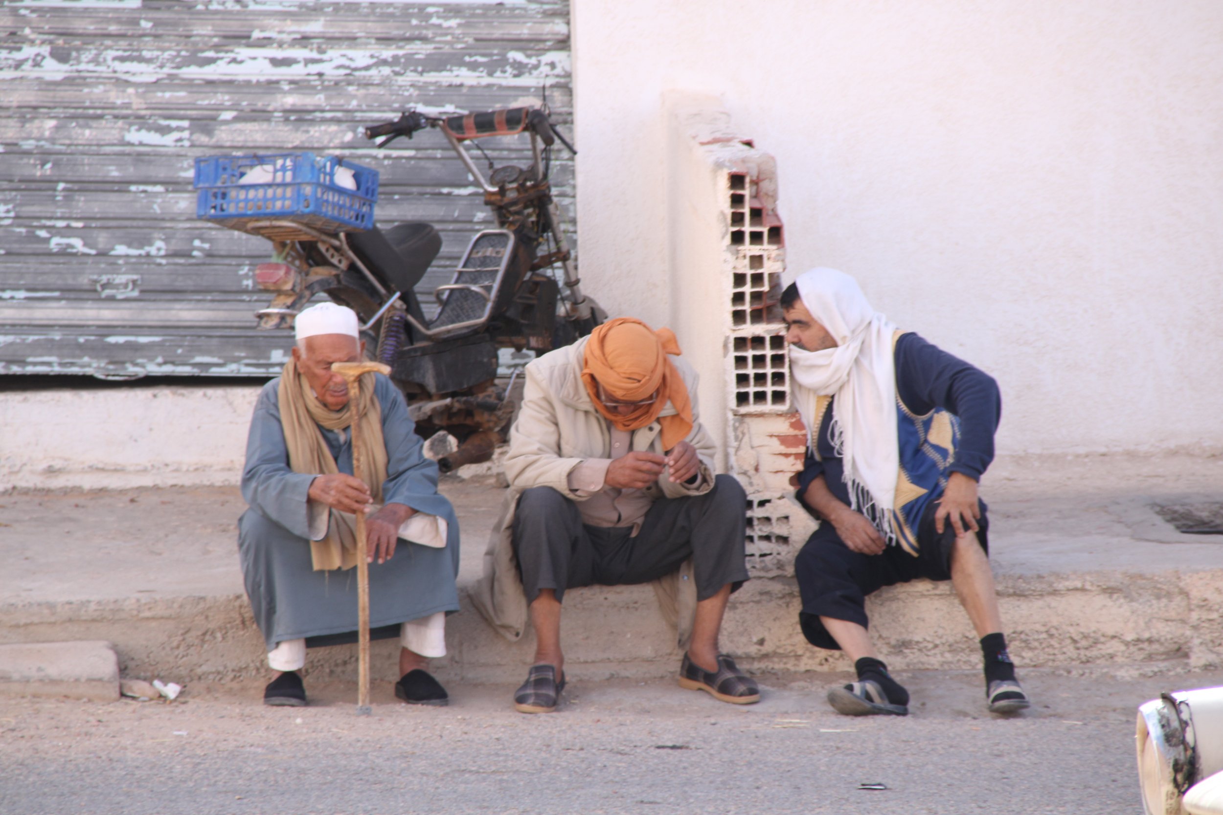  NOVEMBER 20th, 2022. PICTURED: Berber men rest at midday in one of the new towns. PC: Andrew Corbley © 