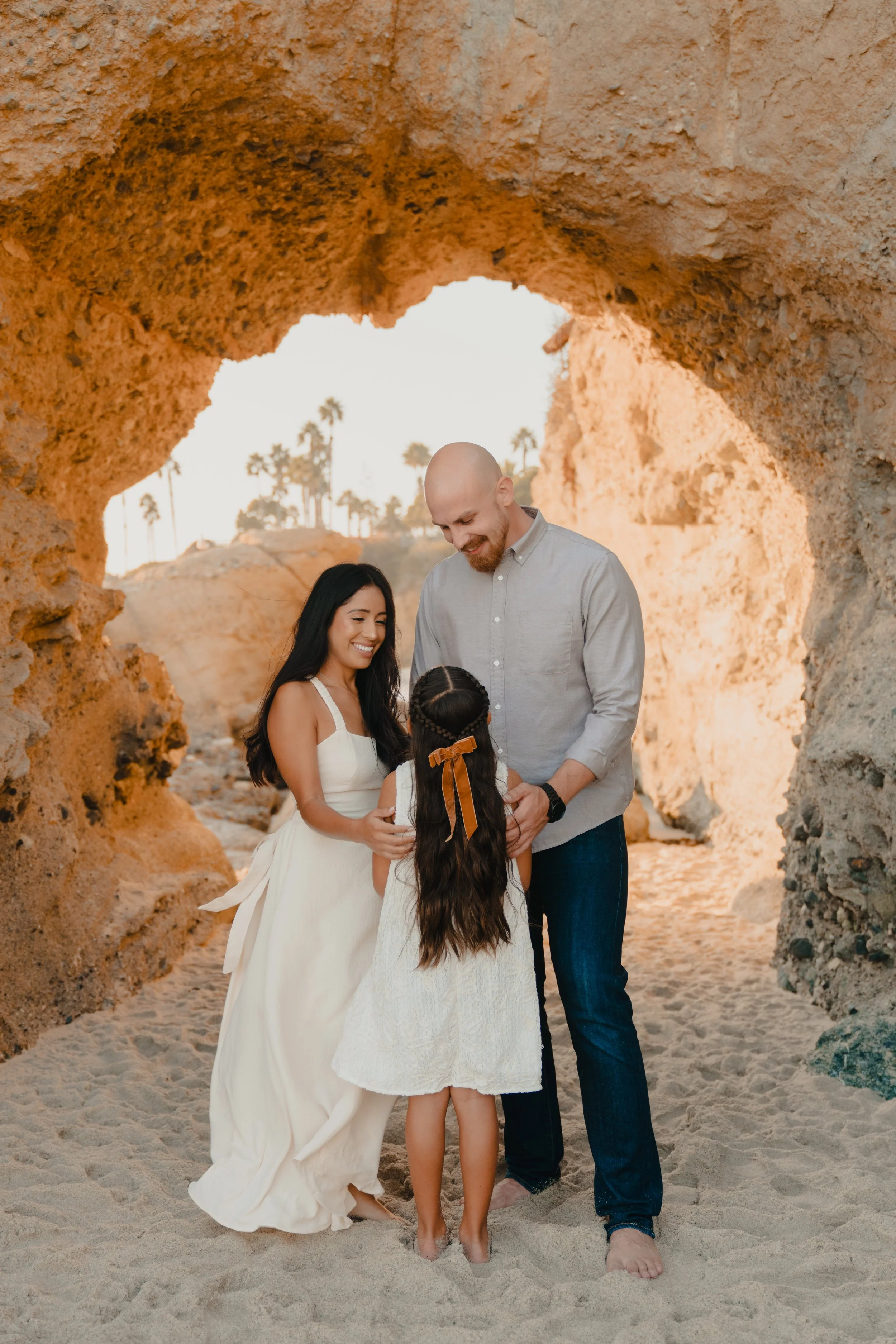Family portrait session inside a coastal cave in Laguna Beach California.