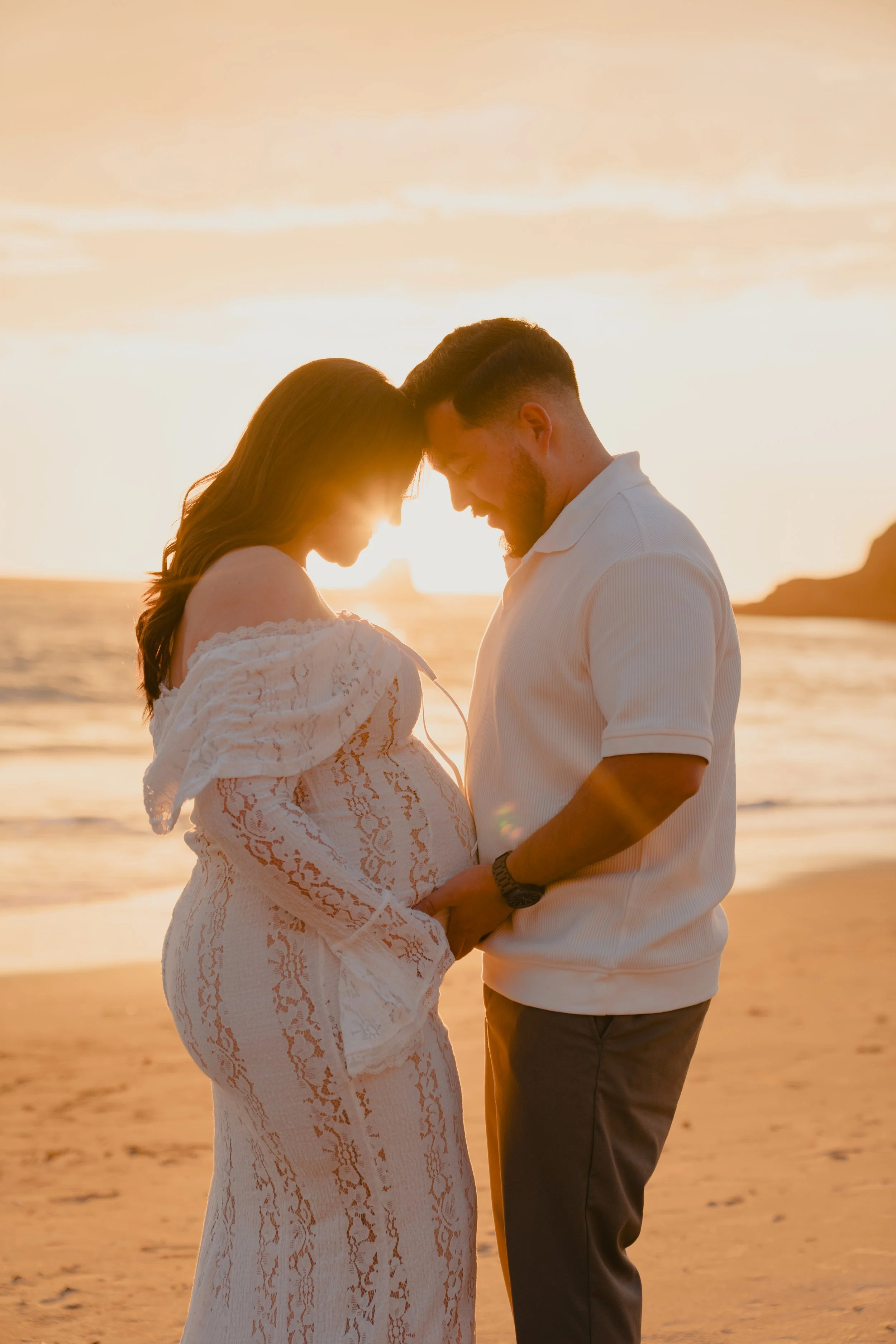 Couple portrait session at sunset on the beach in Laguna Beach Orange County.